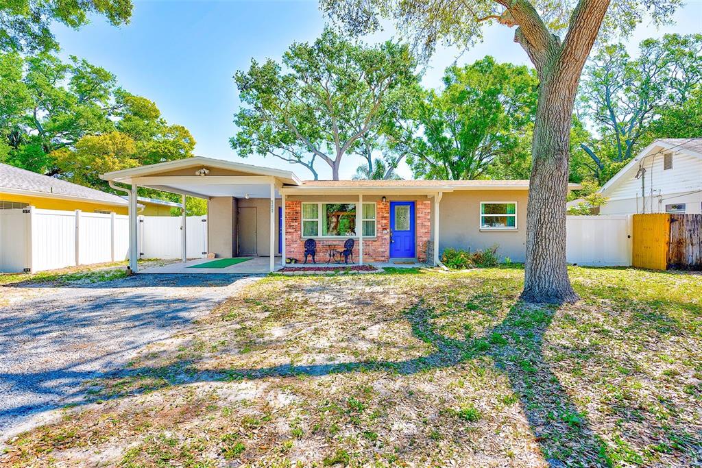 700 16th Street Northwest Largo, FL 33770 - Photo 1 of 1 a view of a house with backyard and trees