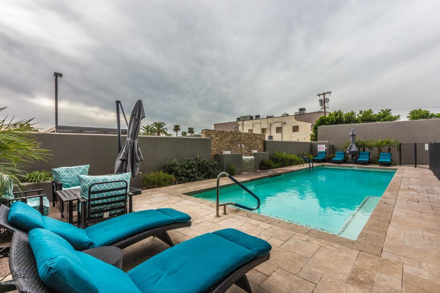 535 West Thomas Road, Unit 211 Phoenix, AZ 85013 - Photo 14 of 24 a view of a chairs in back yard of the house