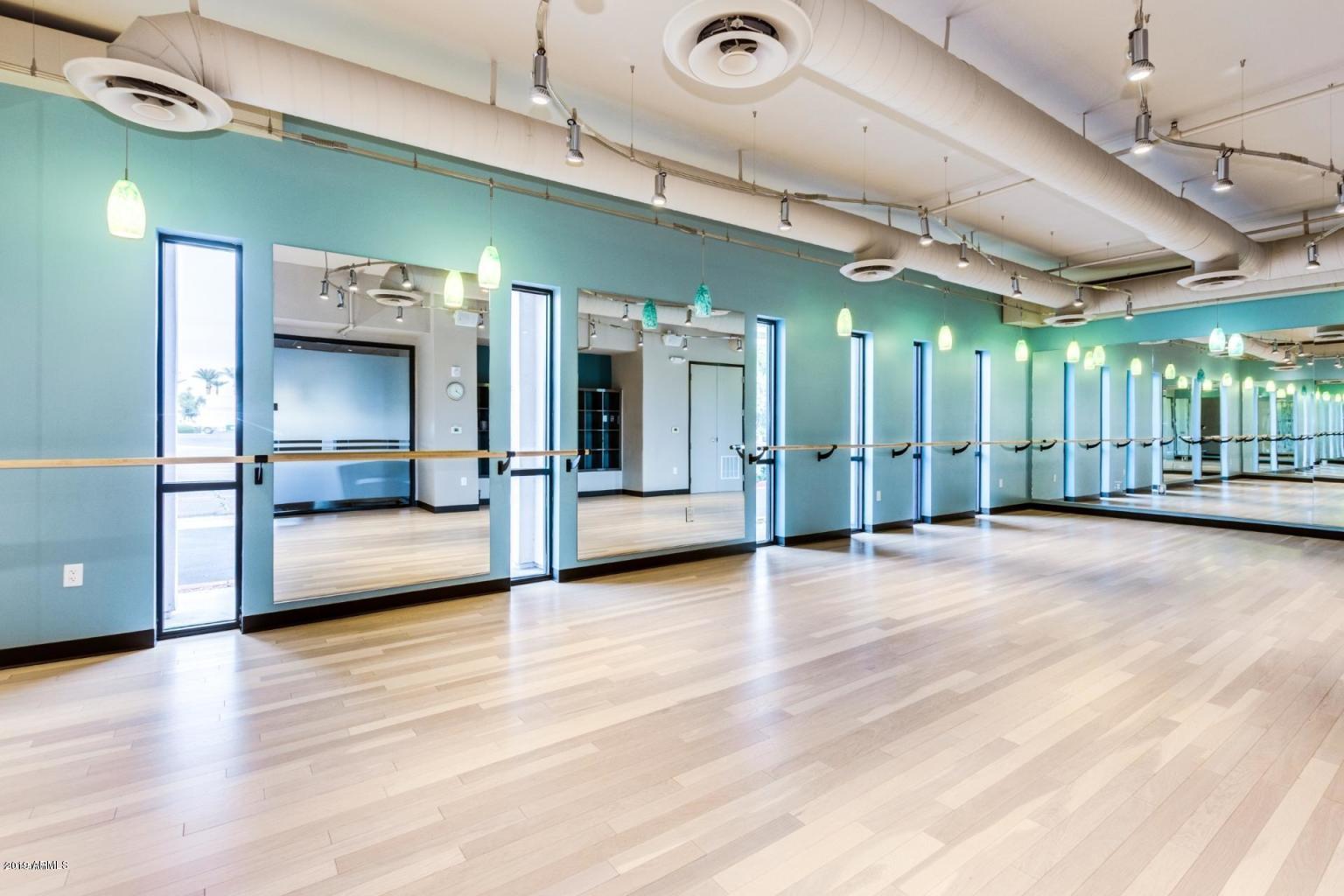 535 West Thomas Road, Unit 211 Phoenix, AZ 85013 - Photo 15 of 24 a view of a hallway with a livingroom and furniture