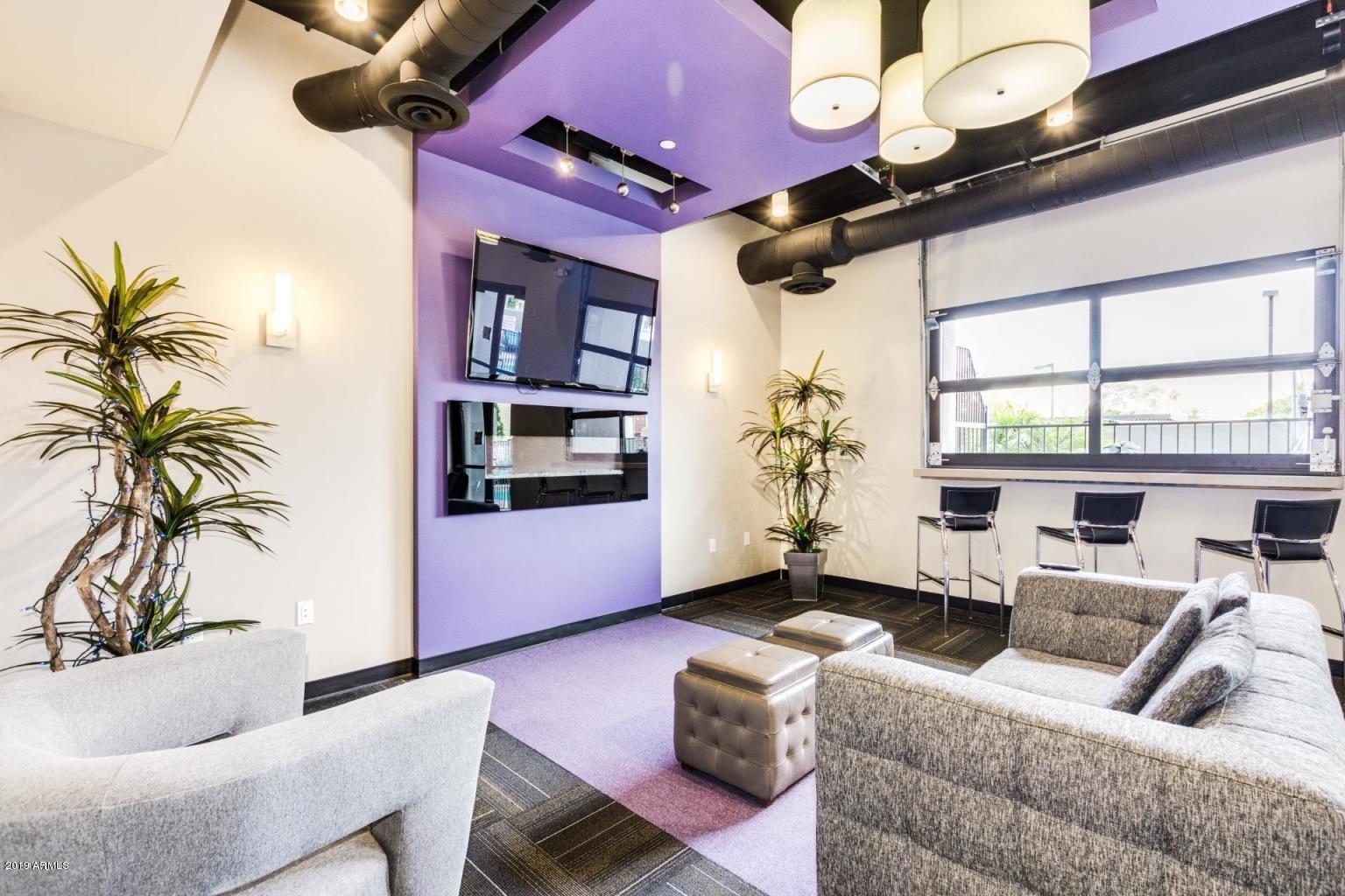 535 West Thomas Road, Unit 211 Phoenix, AZ 85013 - Photo 17 of 24 a living room with furniture and a potted plant