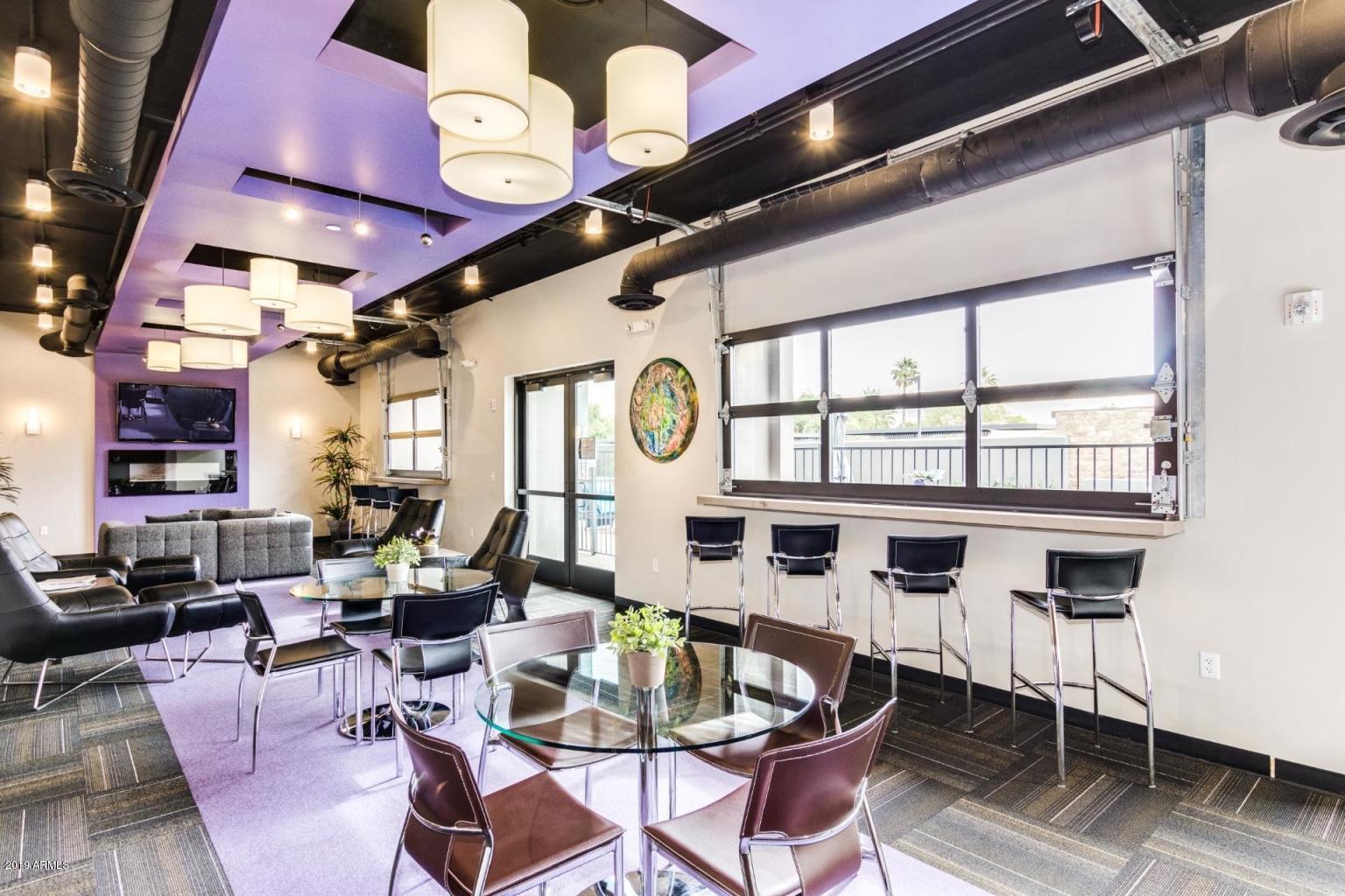 535 West Thomas Road, Unit 211 Phoenix, AZ 85013 - Photo 19 of 24 a living room with fireplace furniture and a large window