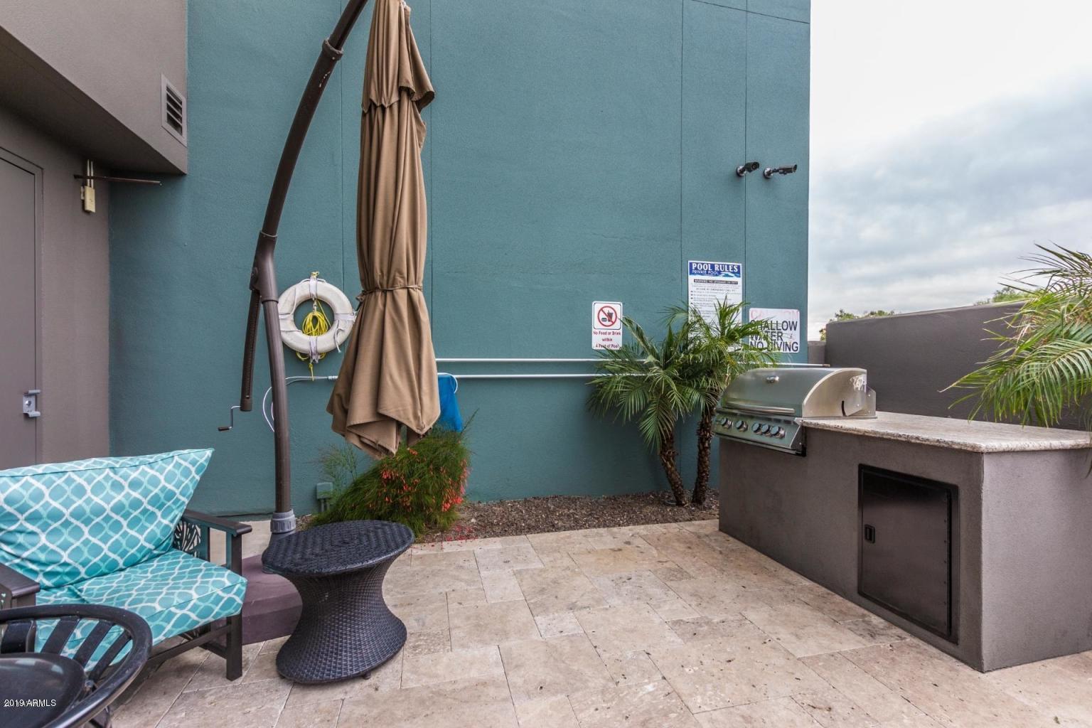 535 West Thomas Road, Unit 211 Phoenix, AZ 85013 - Photo 20 of 24 a vase of flowers sitting on a table