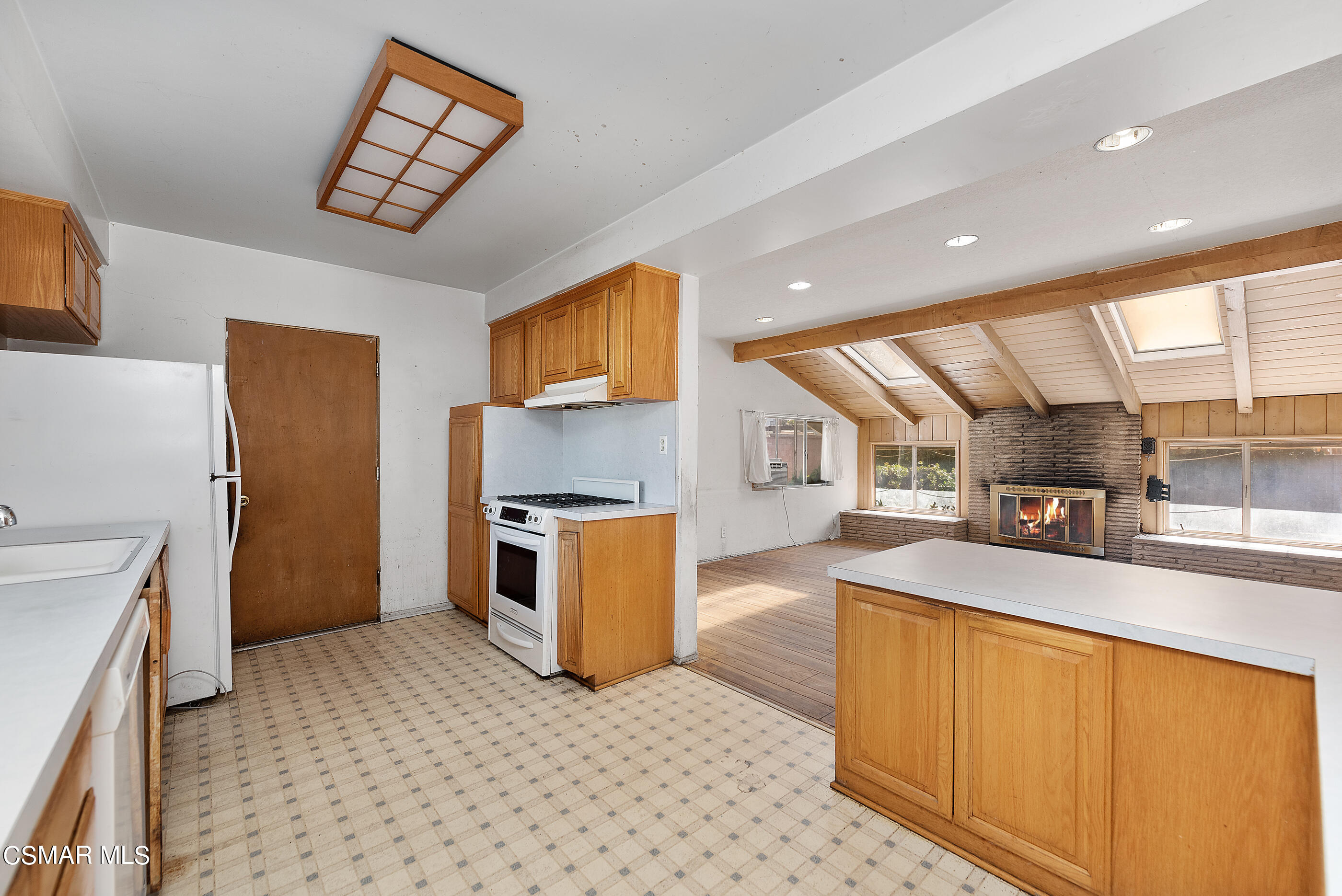 3140 Sheri Drive Simi Valley, CA 93063 - Photo 13 of 38 a kitchen with stainless steel appliances kitchen island granite countertop a refrigerator and a stove top oven