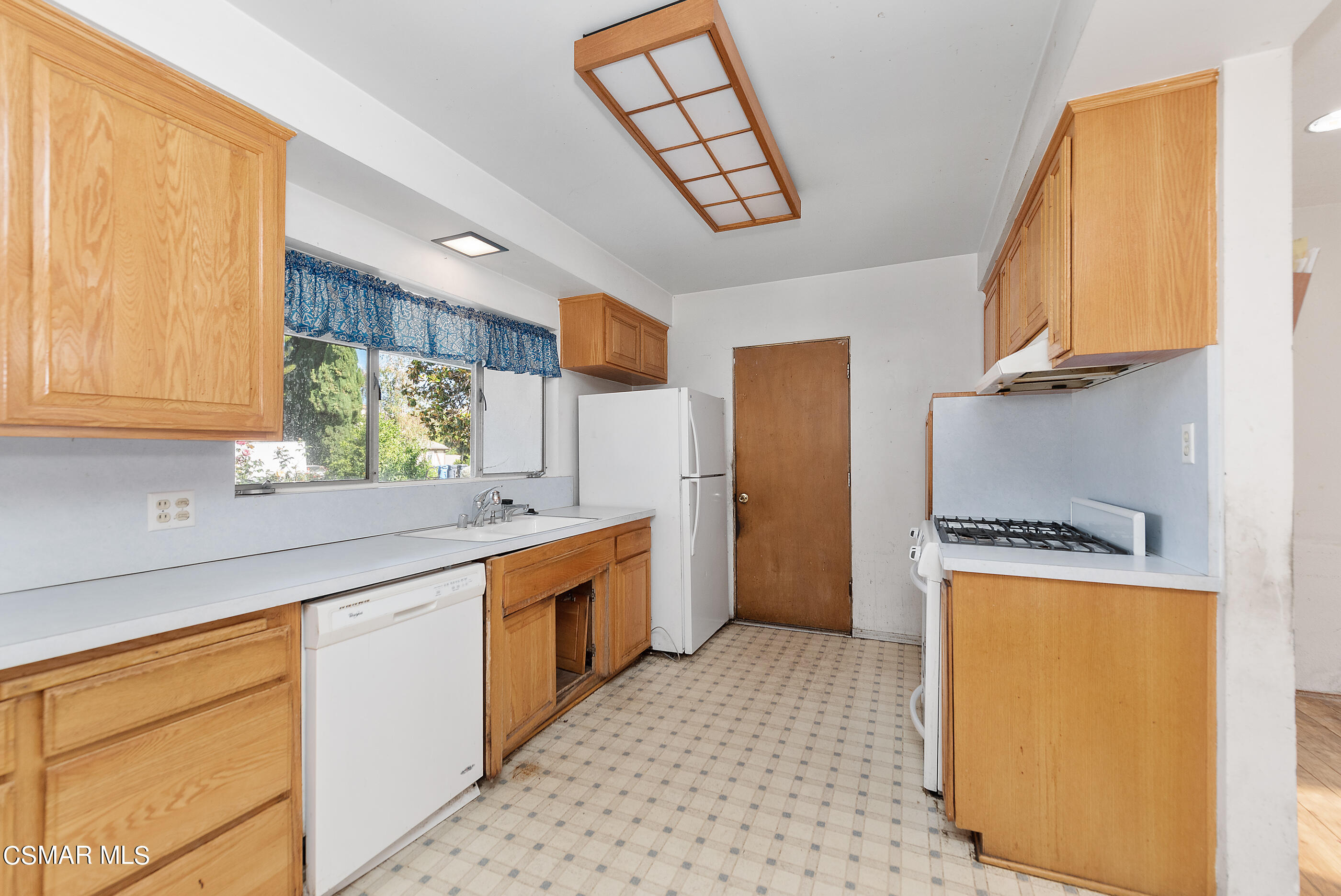 3140 Sheri Drive Simi Valley, CA 93063 - Photo 14 of 38 a kitchen with stainless steel appliances granite countertop a sink a stove and a refrigerator