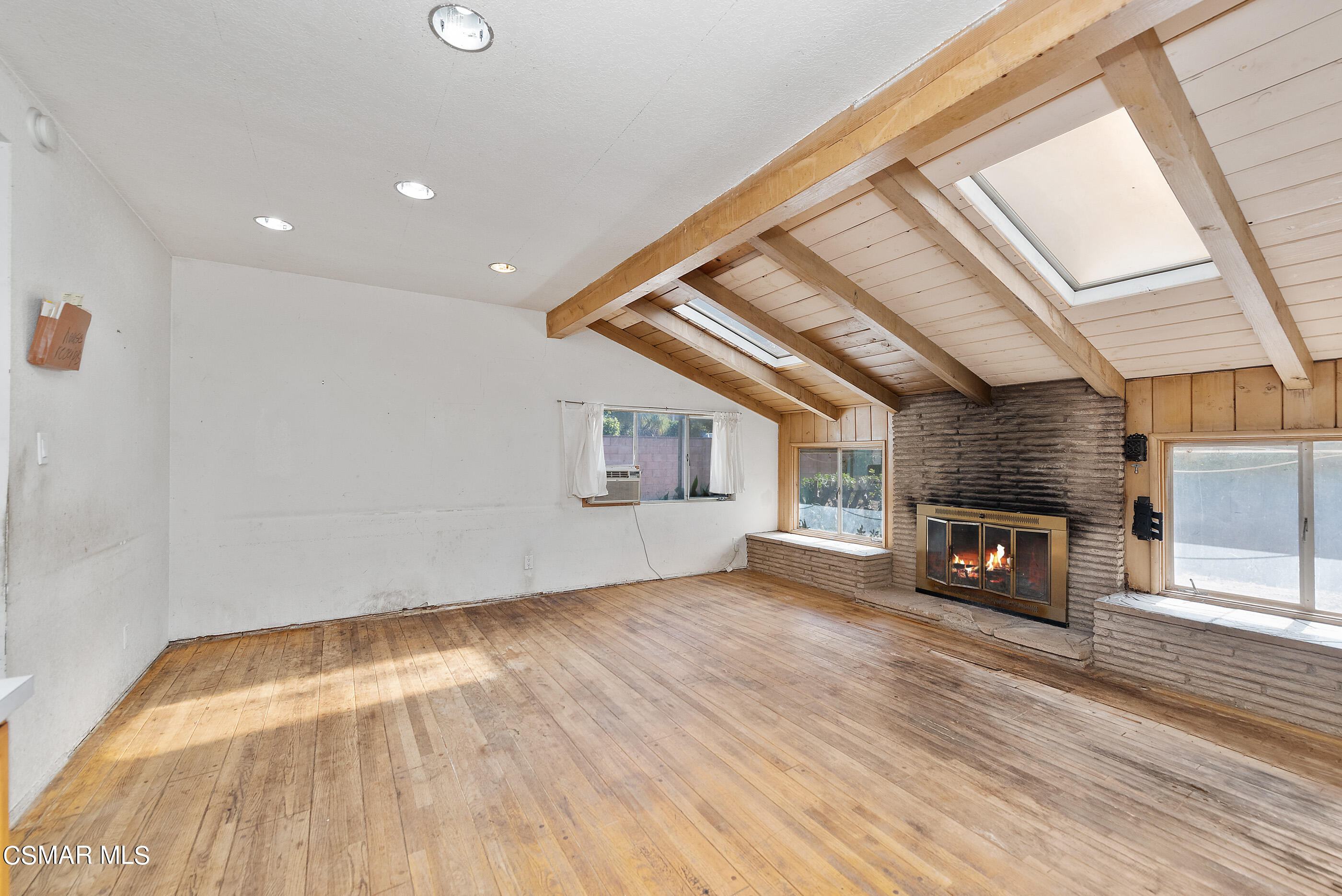 3140 Sheri Drive Simi Valley, CA 93063 - Photo 10 of 38 a view of an empty room with wooden floor fireplace and a window