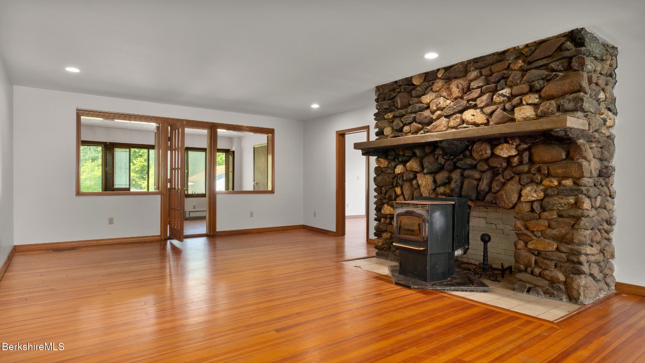 20 East Dugway Road Lenox, MA 01240 - Photo 19 of 84 a view of an empty room with window and fireplace