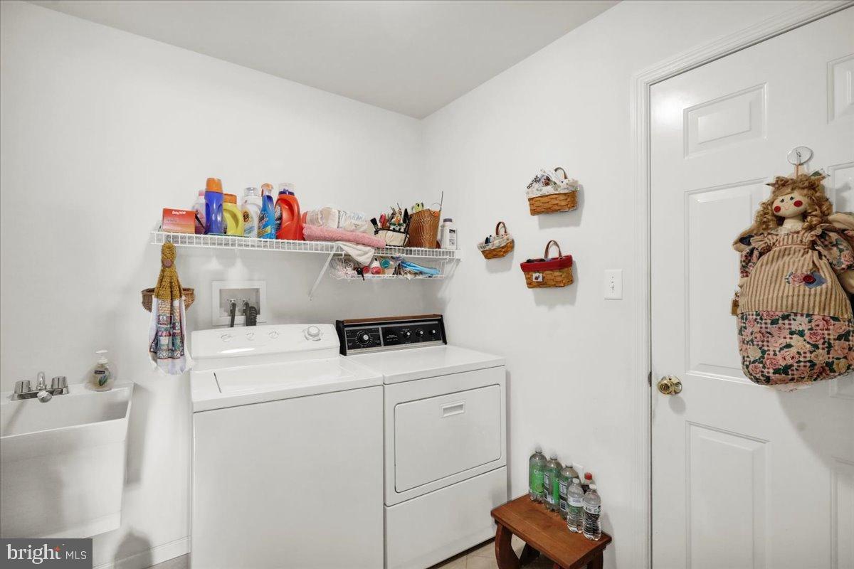 2509 Joshua Drive Sinking Spring, PA 19608 - Photo 14 of 35 a utility room with toys and wooden floor