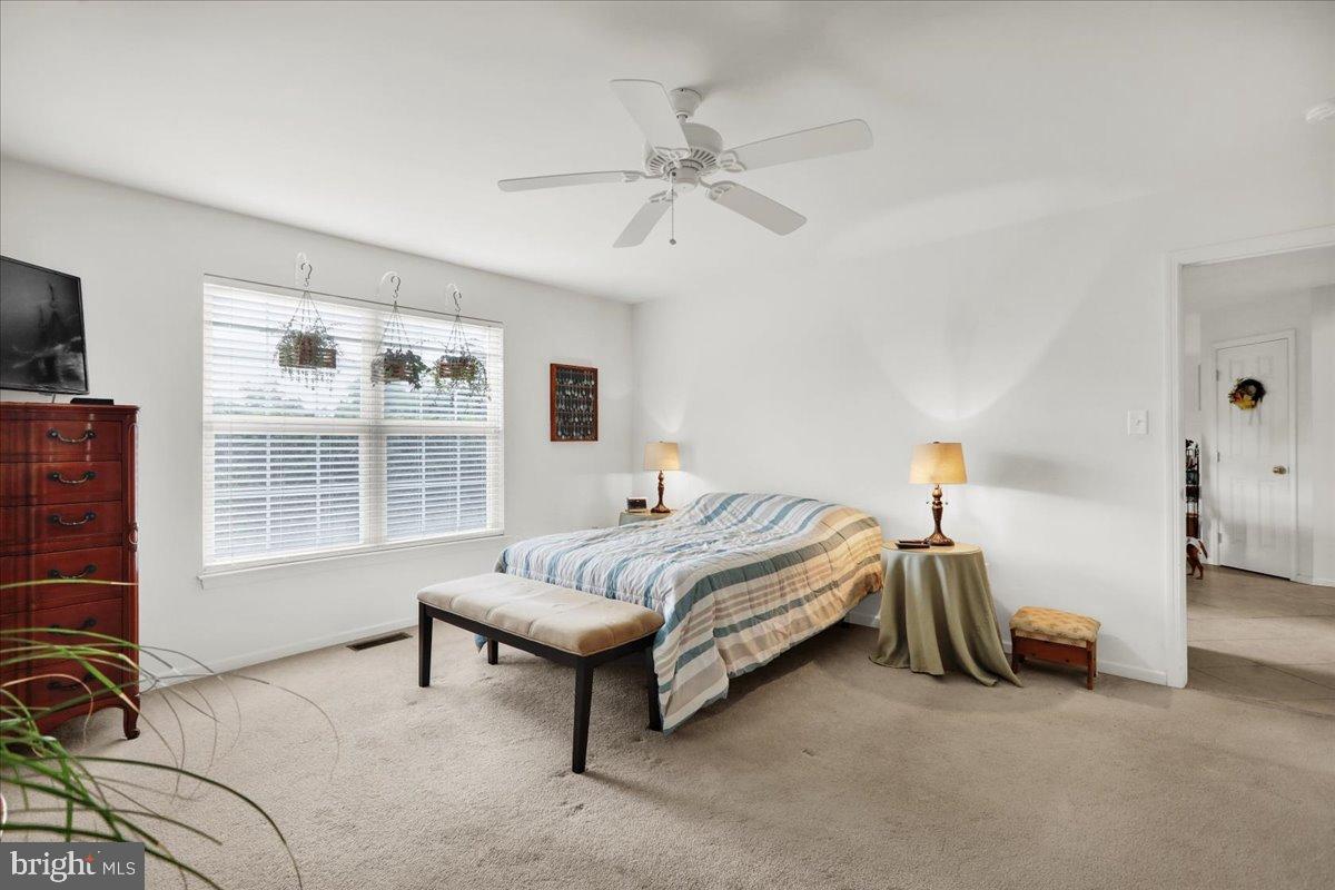 2509 Joshua Drive Sinking Spring, PA 19608 - Photo 17 of 35 a spacious bedroom with a bed and a window