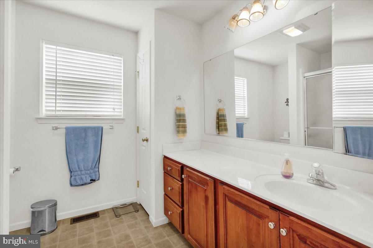 2509 Joshua Drive Sinking Spring, PA 19608 - Photo 18 of 35 a bathroom with a sink and a mirror