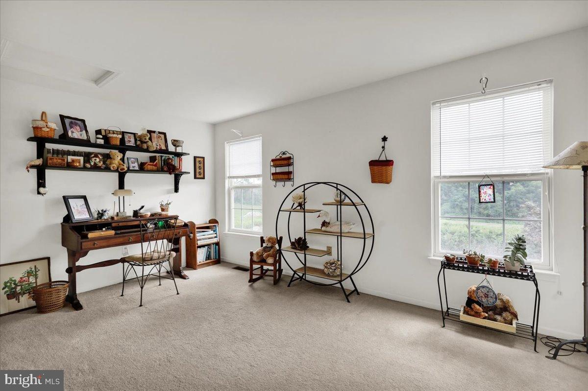 2509 Joshua Drive Sinking Spring, PA 19608 - Photo 25 of 35 a room with gym equipment and a large window