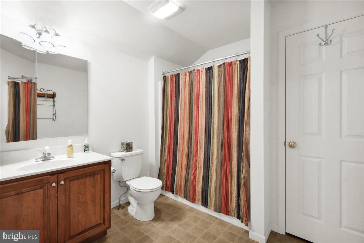 2509 Joshua Drive Sinking Spring, PA 19608 - Photo 27 of 35 a bathroom with a toilet a sink and a mirror