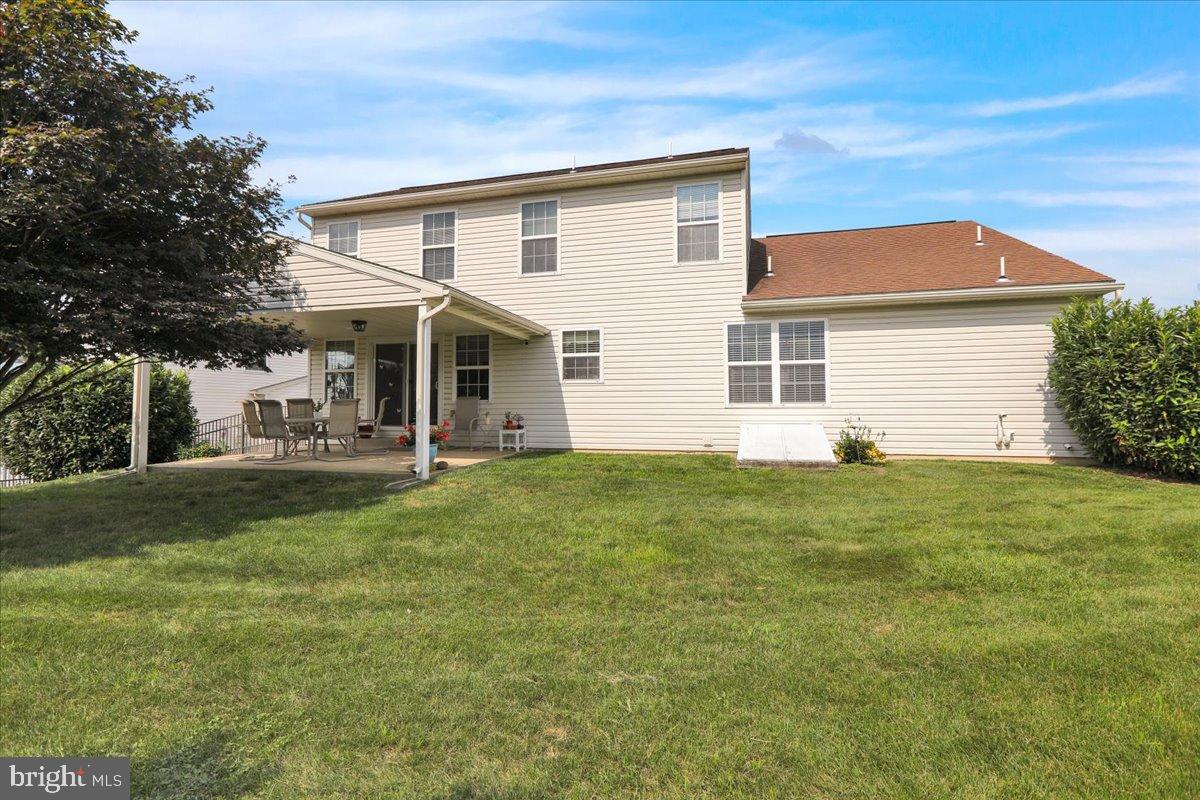 2509 Joshua Drive Sinking Spring, PA 19608 - Photo 32 of 35 a view of a white house with a big yard and potted plants