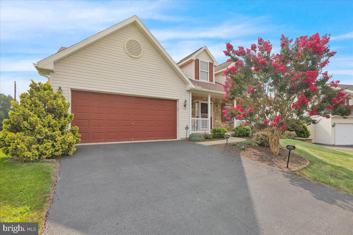 2509 Joshua Drive Sinking Spring, PA 19608 - Photo 34 of 35 a front view of a house with a yard and a garage