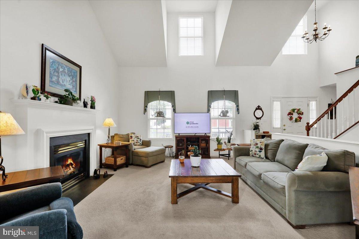 2509 Joshua Drive Sinking Spring, PA 19608 - Photo 4 of 35 a living room with furniture a fireplace and a potted plant