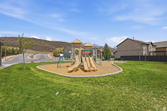 2007 Fielding Hill Lane Draper, UT 84020 - Photo 49 of 83 Community playground featuring a multi-level play structure with slides and swings