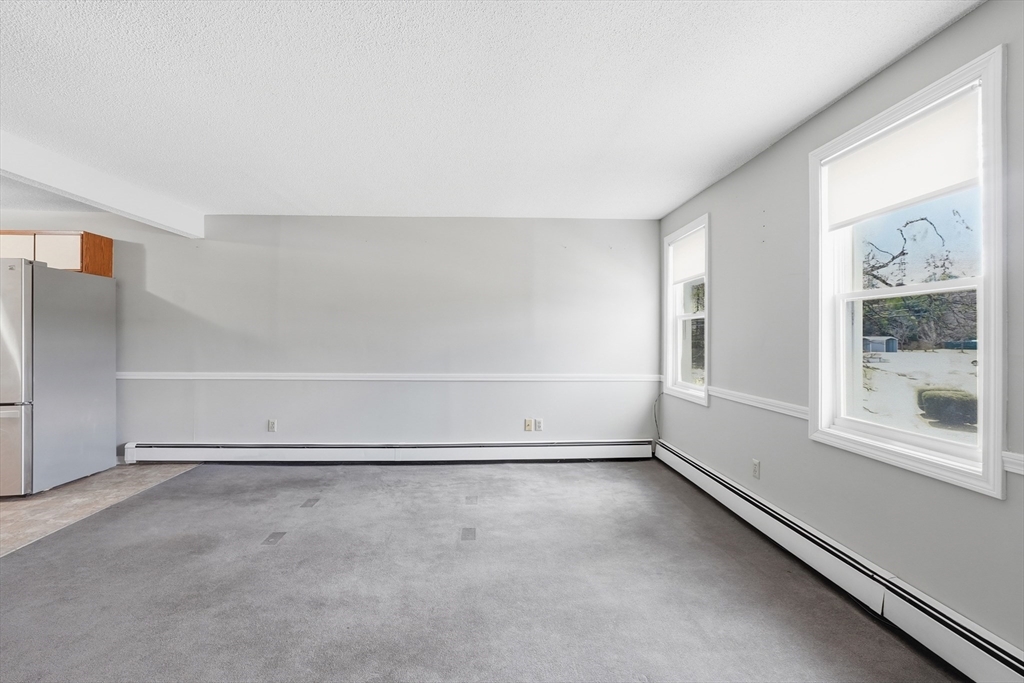 146 Hecla Street, Unit 2 Uxbridge, MA 01569 - Photo 17 of 26 a view of an empty room with a window