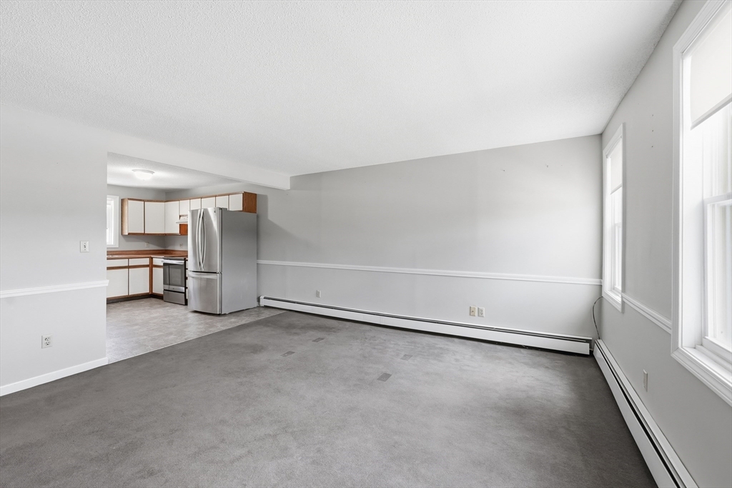 146 Hecla Street, Unit 2 Uxbridge, MA 01569 - Photo 18 of 26 an empty room with shelves