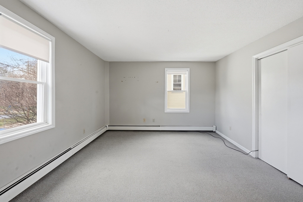 146 Hecla Street, Unit 2 Uxbridge, MA 01569 - Photo 20 of 26 an empty room with a window
