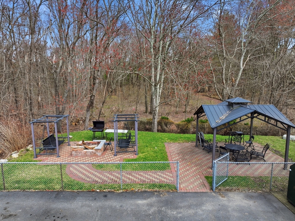 146 Hecla Street, Unit 2 Uxbridge, MA 01569 - Photo 7 of 26 a view of backyard with sitting area