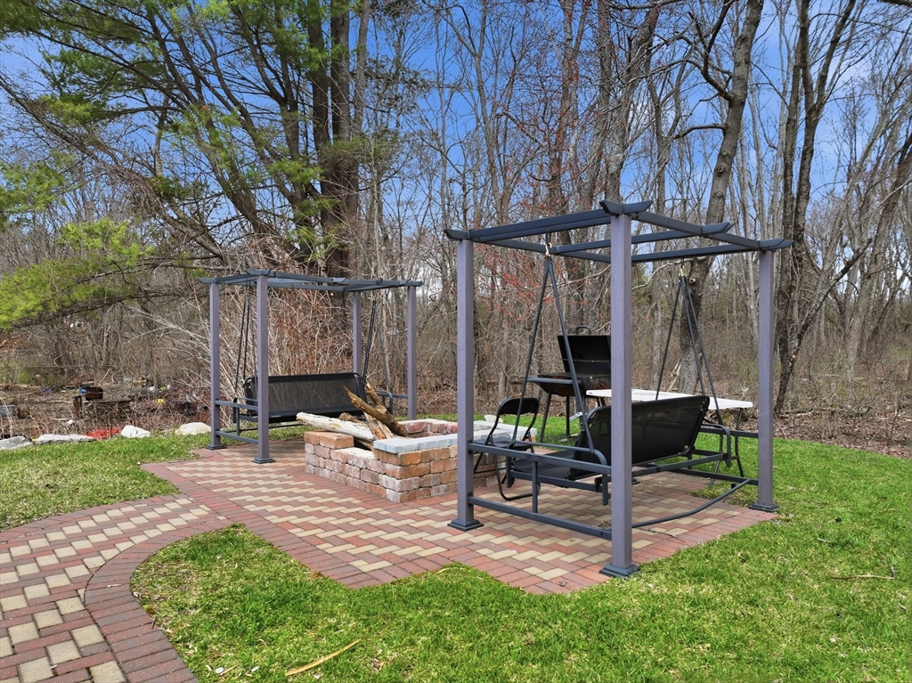 146 Hecla Street, Unit 2 Uxbridge, MA 01569 - Photo 10 of 26 a view of yard with patio