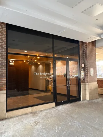 a view of water heater room with glass door