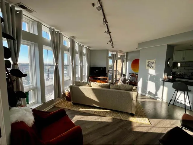 a living room with furniture and a flat screen tv