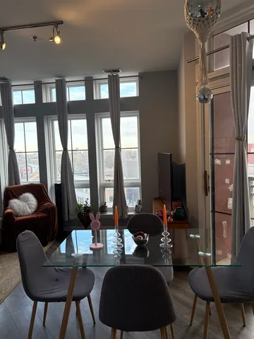 a room with a large window and furniture