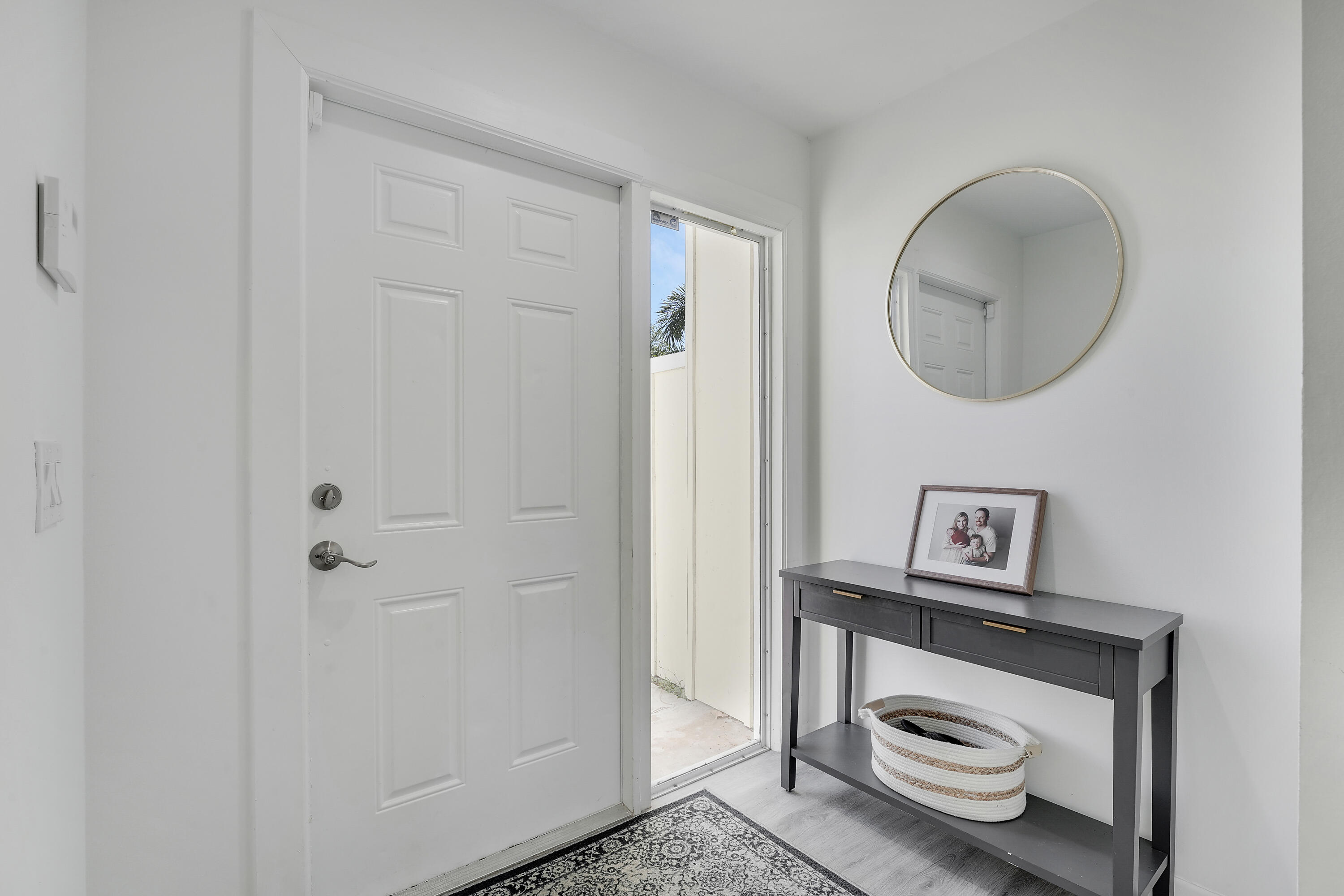 6263 Riverwalk Lane, Unit 2 Jupiter, FL 33458 - Photo 11 of 44 a bathroom with a toilet and a mirror