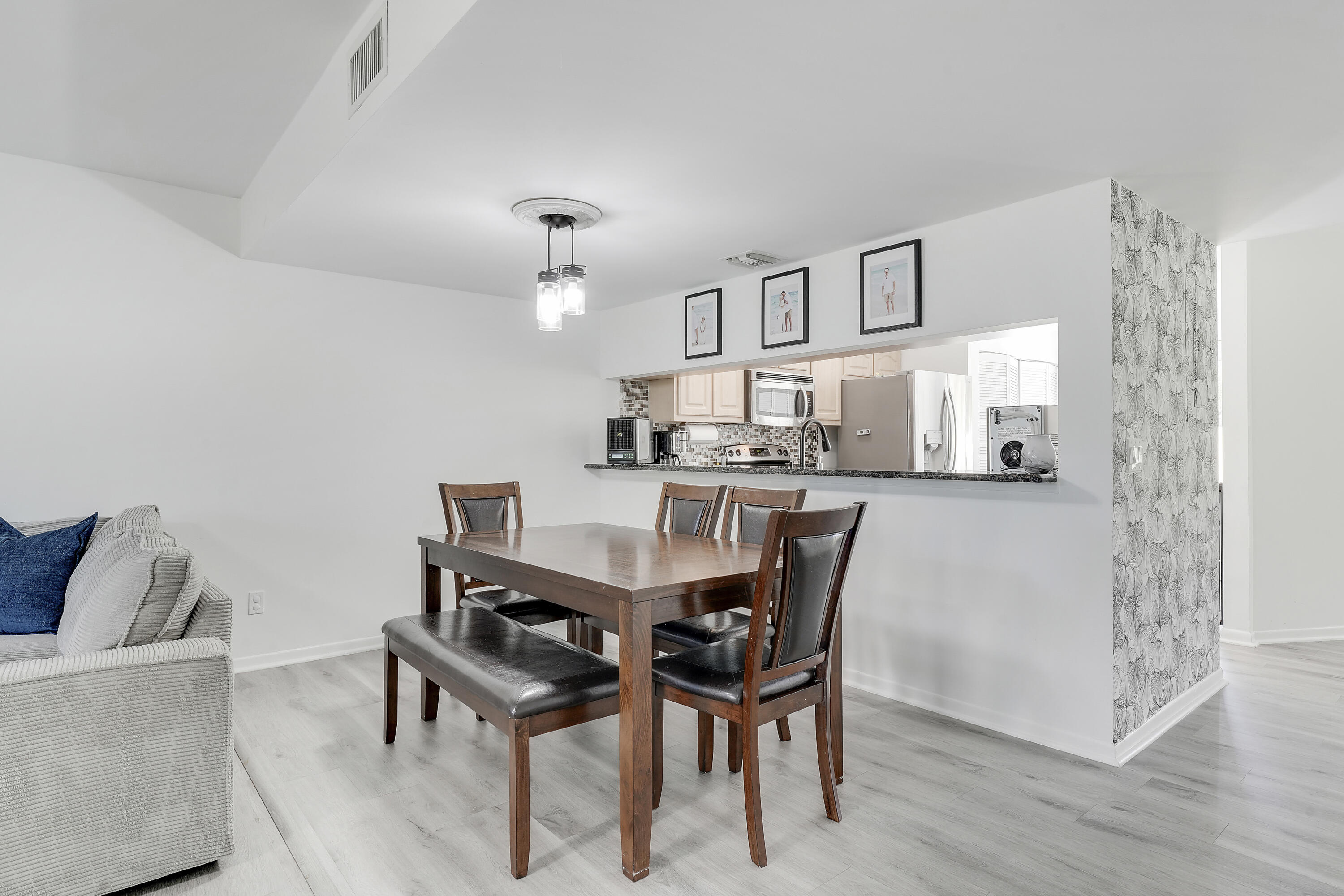 6263 Riverwalk Lane, Unit 2 Jupiter, FL 33458 - Photo 19 of 44 a dining room with furniture and window