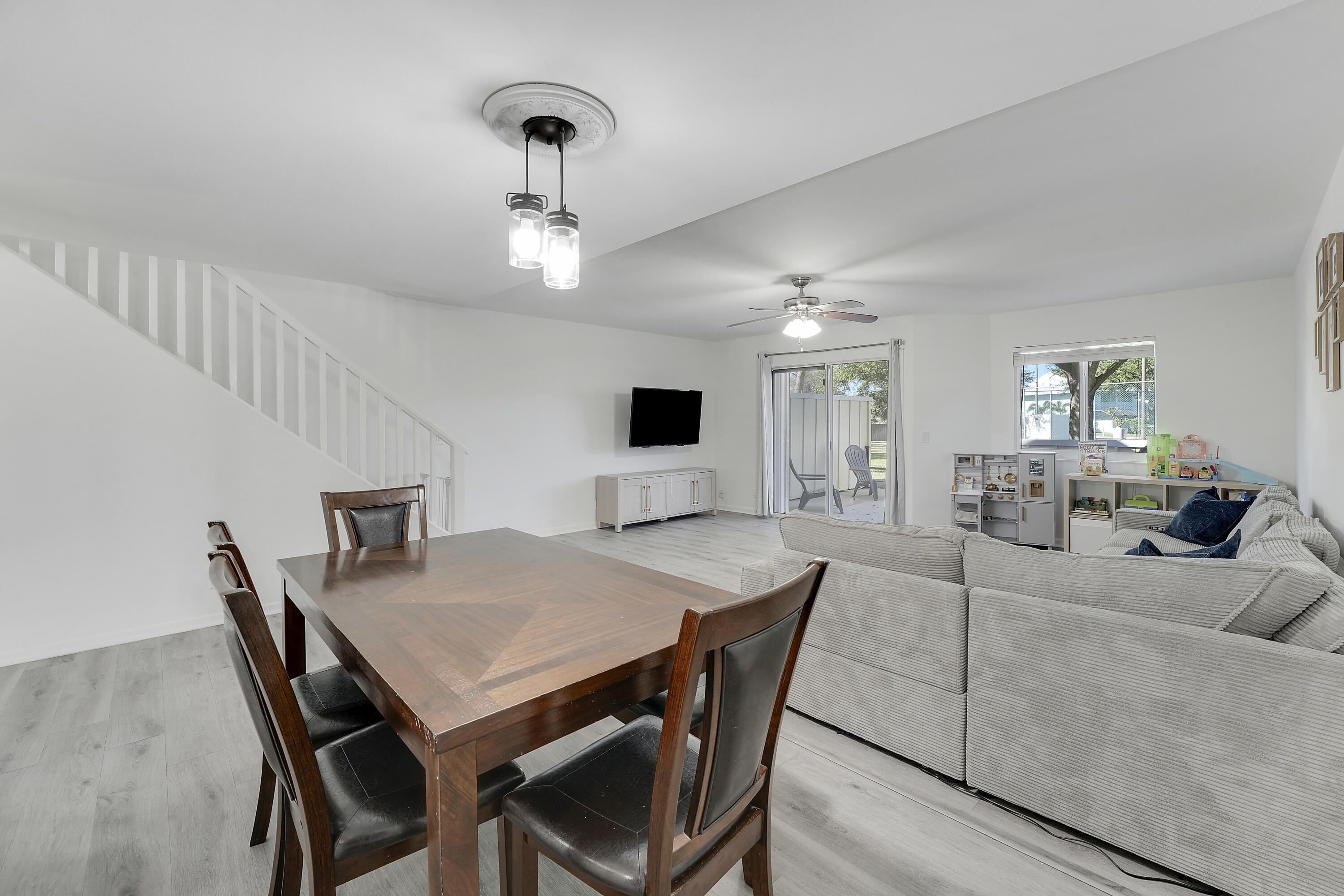 6263 Riverwalk Lane, Unit 2 Jupiter, FL 33458 - Photo 20 of 44 a view of a dining room with furniture and wooden floor