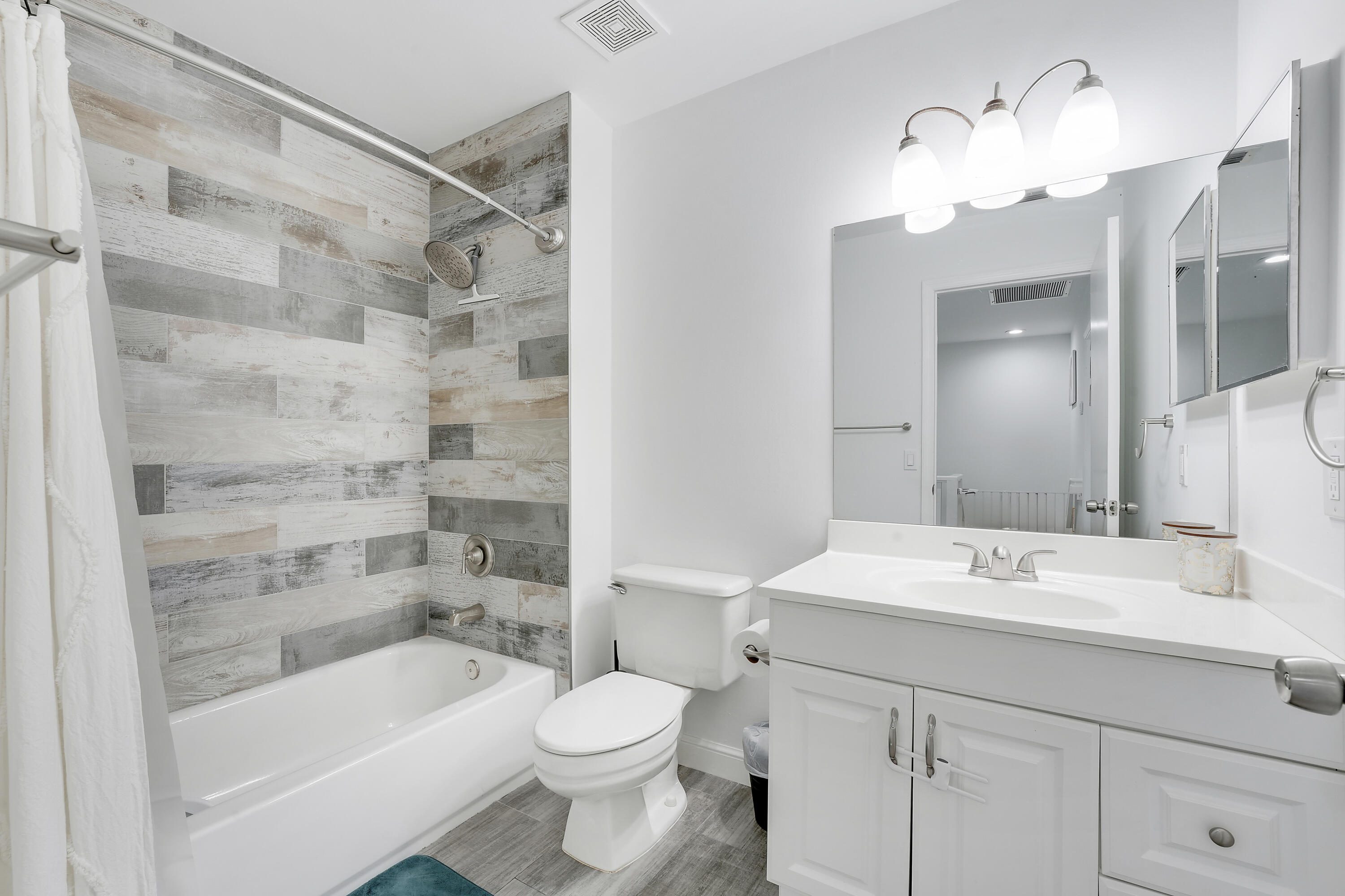 6263 Riverwalk Lane, Unit 2 Jupiter, FL 33458 - Photo 32 of 44 a bathroom with a sink a toilet and shower