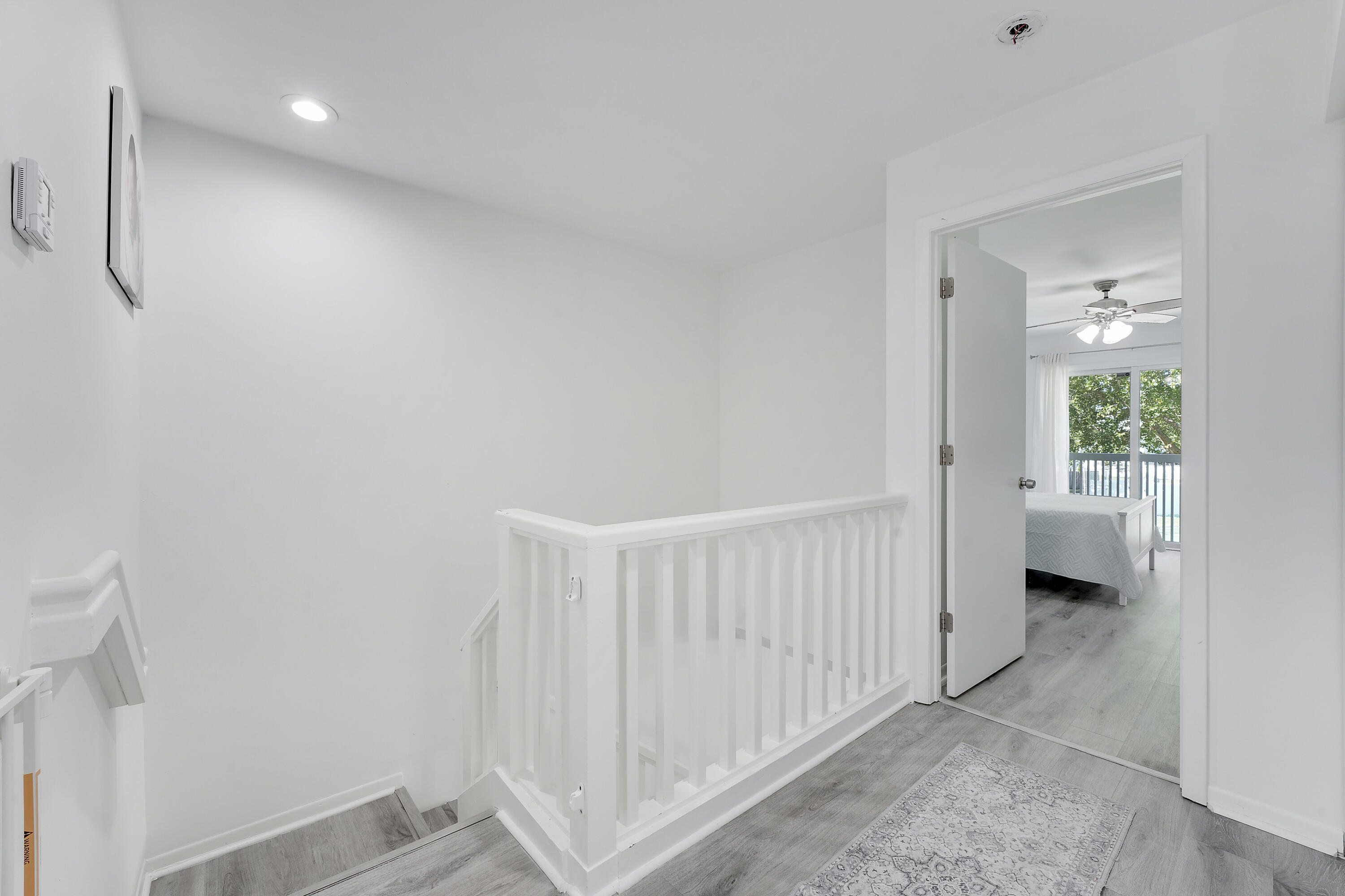 6263 Riverwalk Lane, Unit 2 Jupiter, FL 33458 - Photo 33 of 44 a view of a hallway with a livingroom and a bathroom