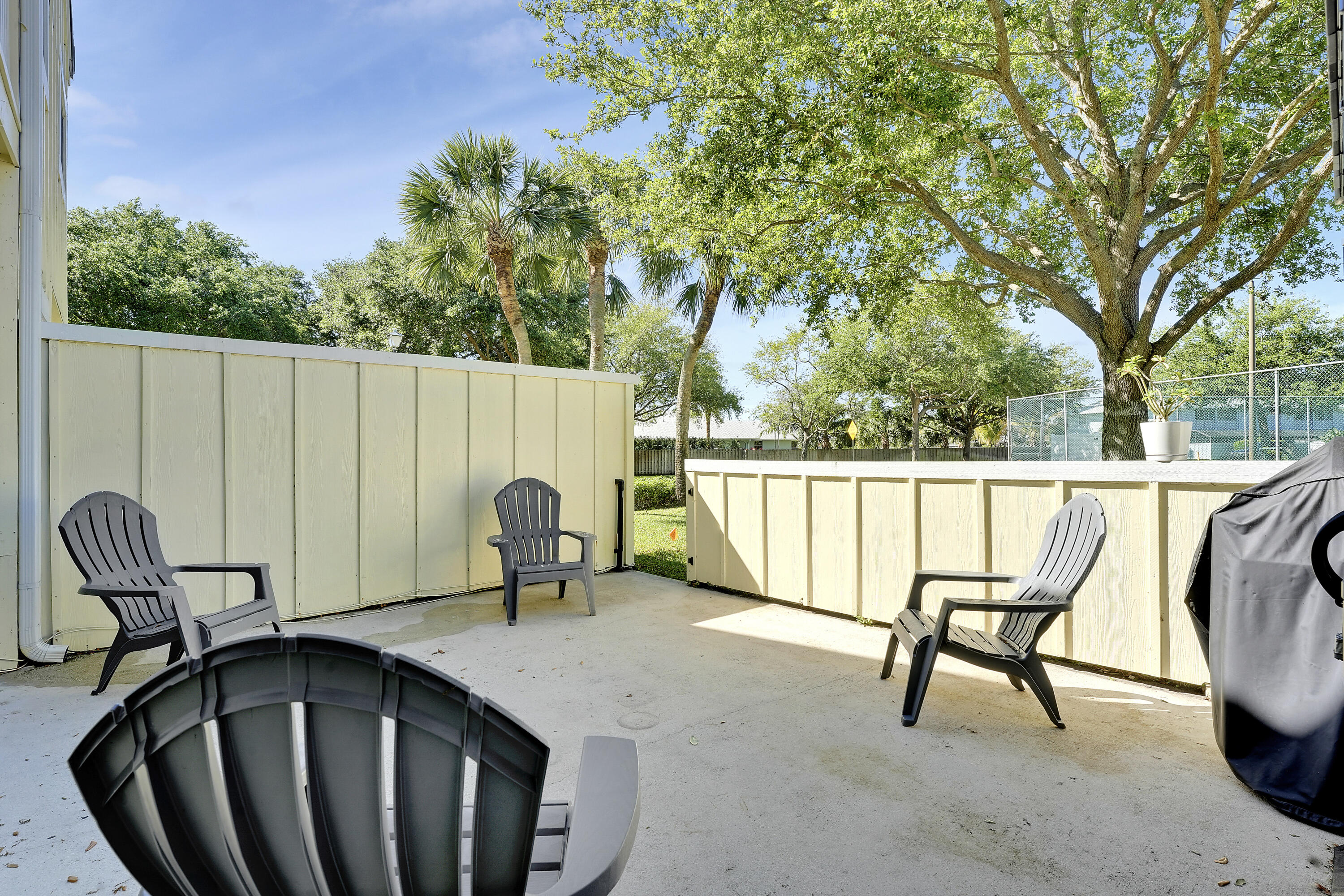 6263 Riverwalk Lane, Unit 2 Jupiter, FL 33458 - Photo 36 of 44 a view of outdoor space with seating and trees