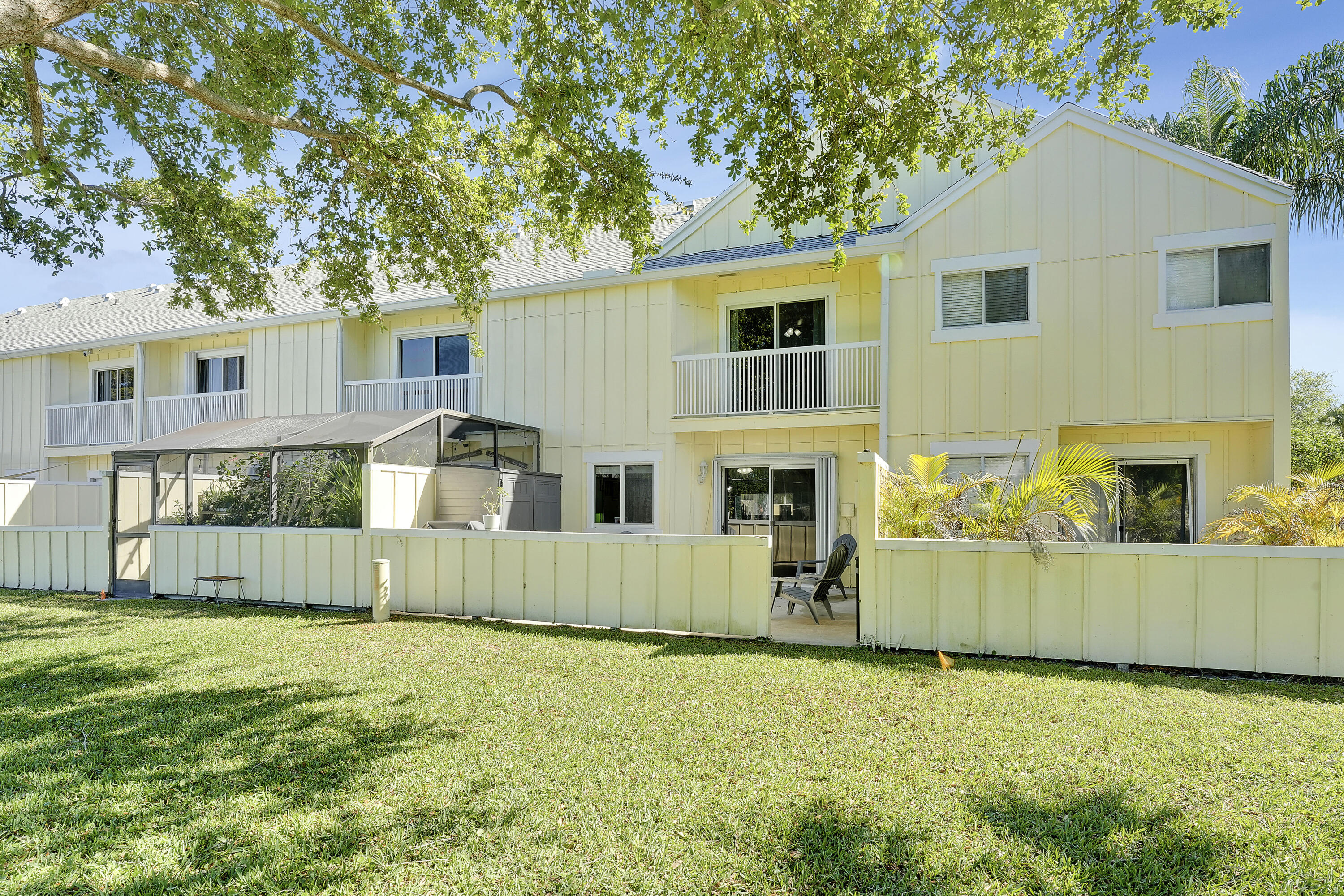 6263 Riverwalk Lane, Unit 2 Jupiter, FL 33458 - Photo 37 of 44 front view of a house with a yard