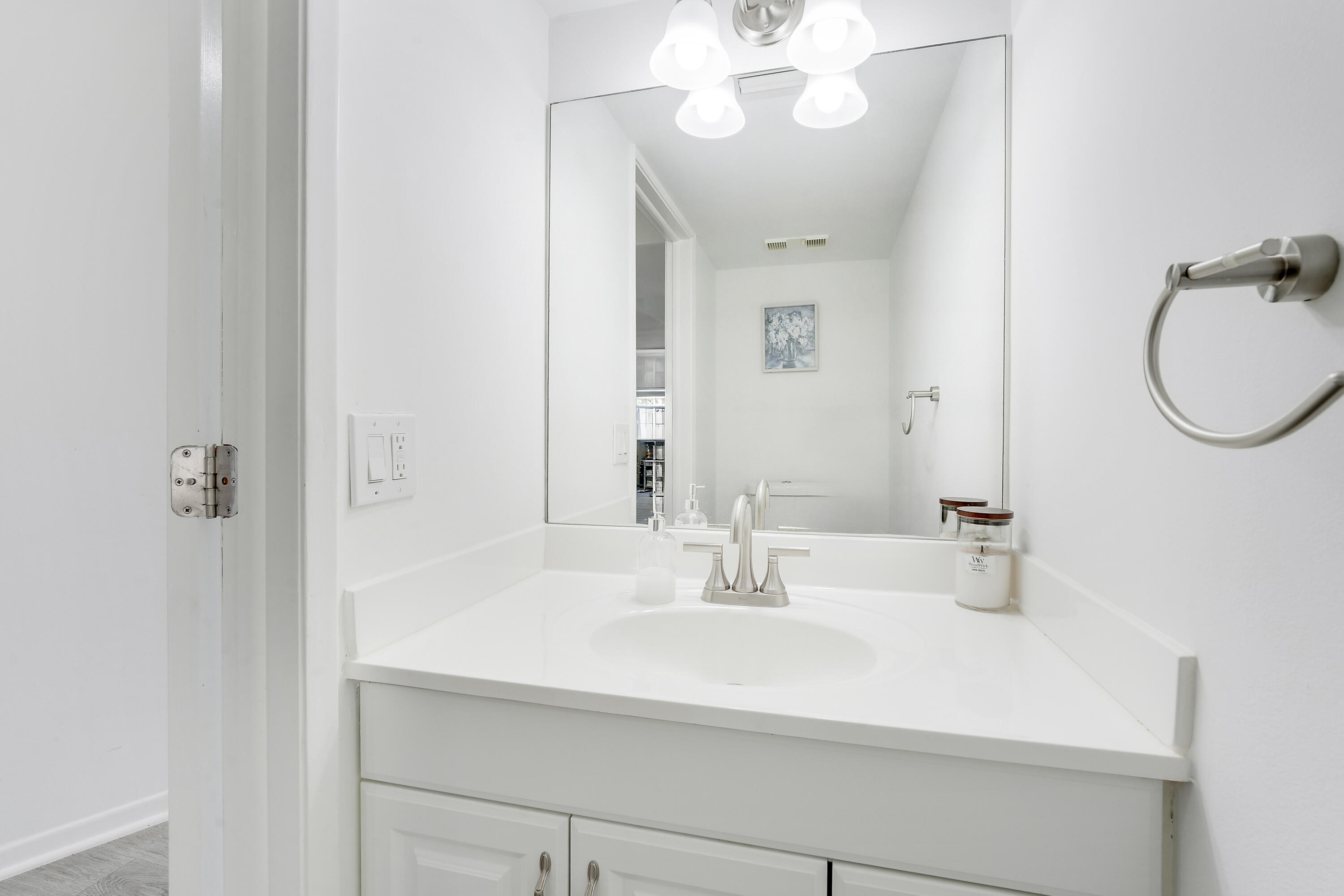 6263 Riverwalk Lane, Unit 2 Jupiter, FL 33458 - Photo 38 of 44 a bathroom with a sink and a mirror