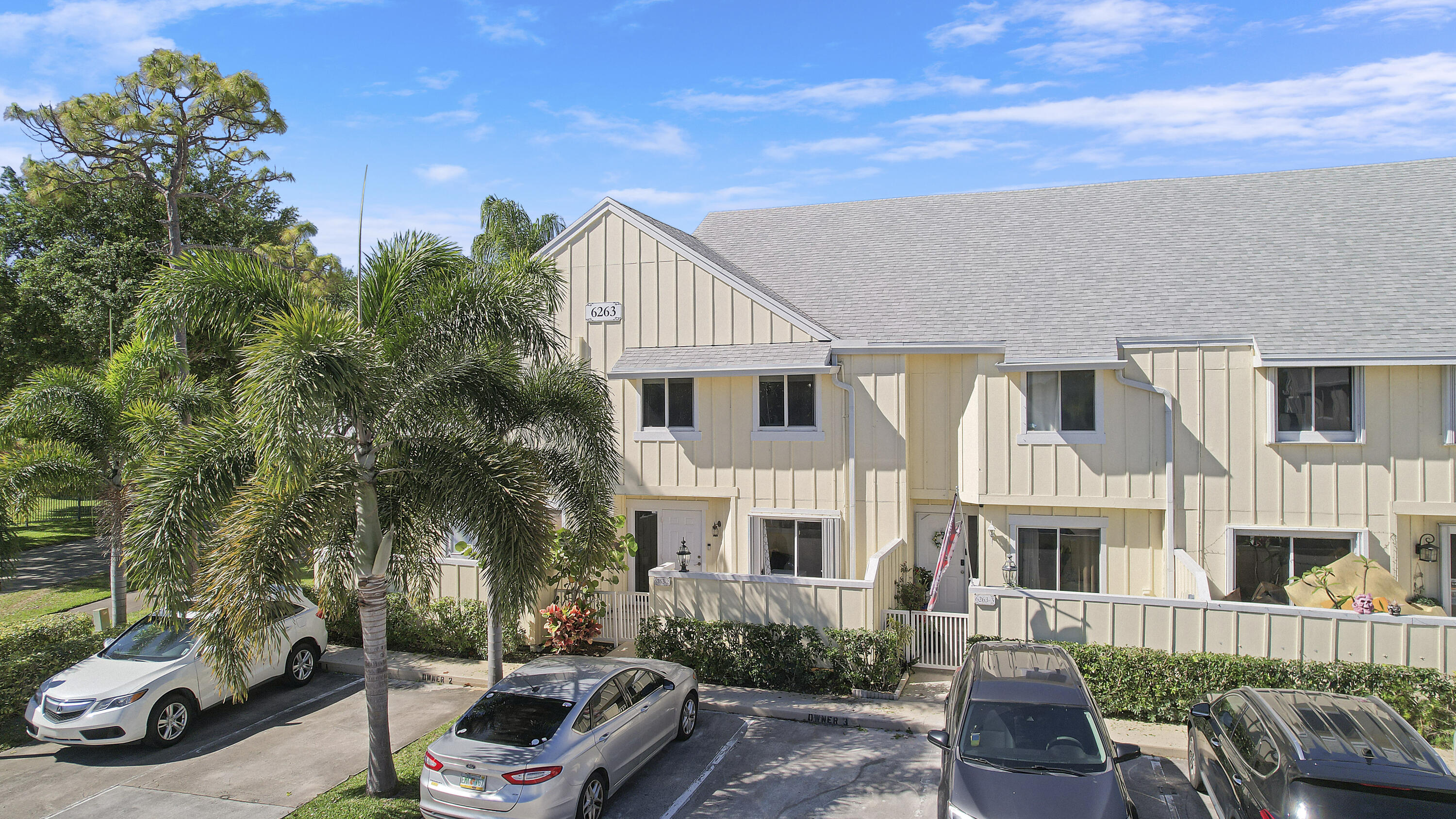 6263 Riverwalk Lane, Unit 2 Jupiter, FL 33458 - Photo 4 of 44 a car parked in front of a house
