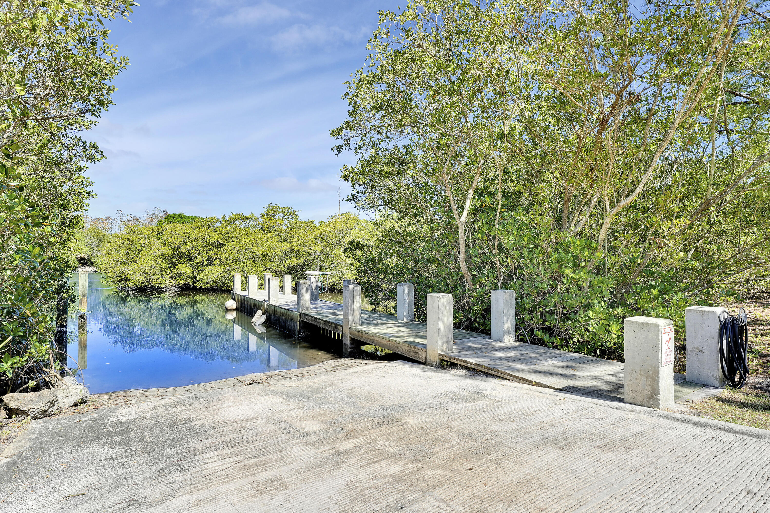 6263 Riverwalk Lane, Unit 2 Jupiter, FL 33458 - Photo 44 of 44 a view of a garden with an outdoor space