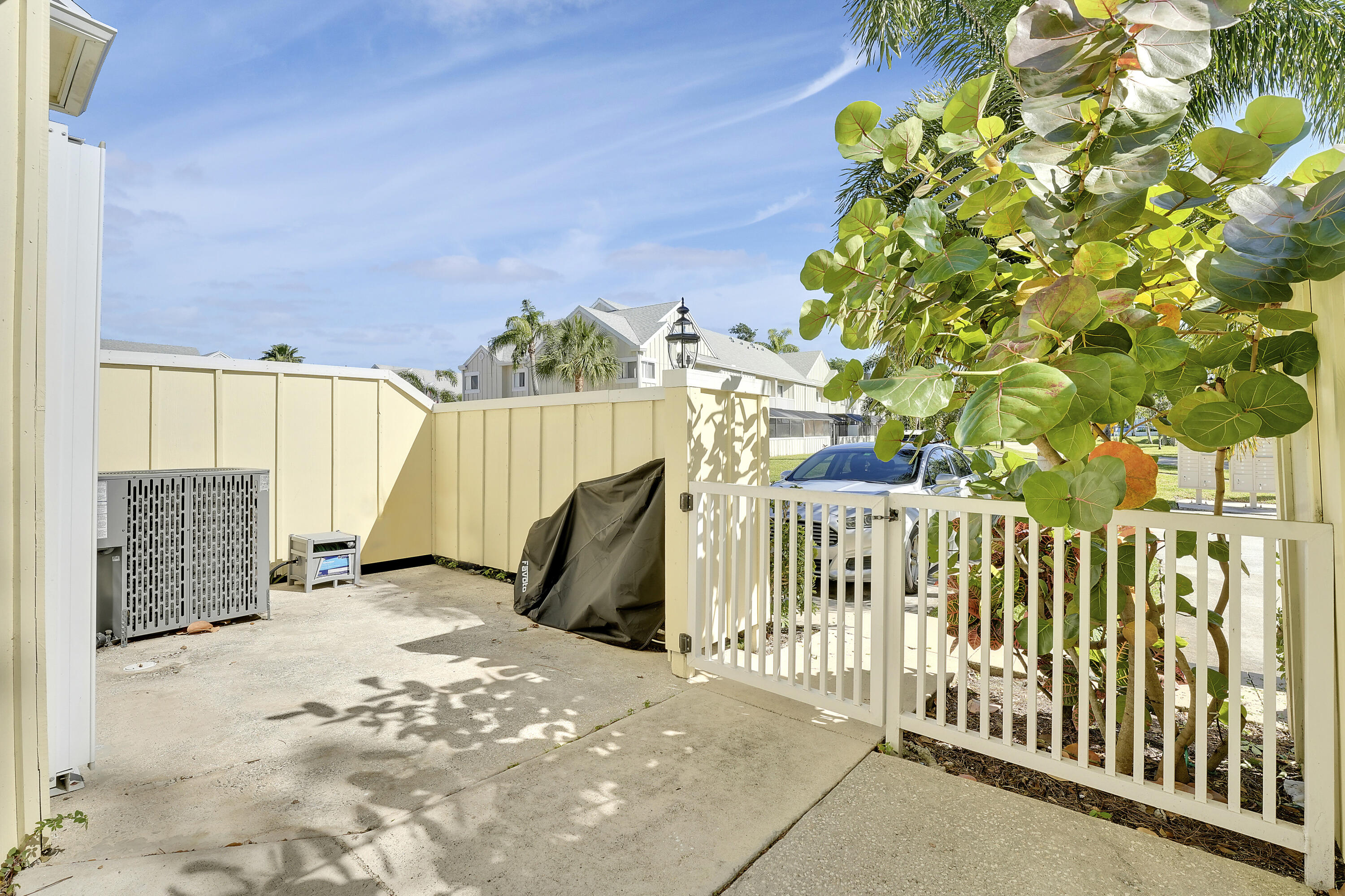 6263 Riverwalk Lane, Unit 2 Jupiter, FL 33458 - Photo 6 of 44 a view of a building with a outdoor space