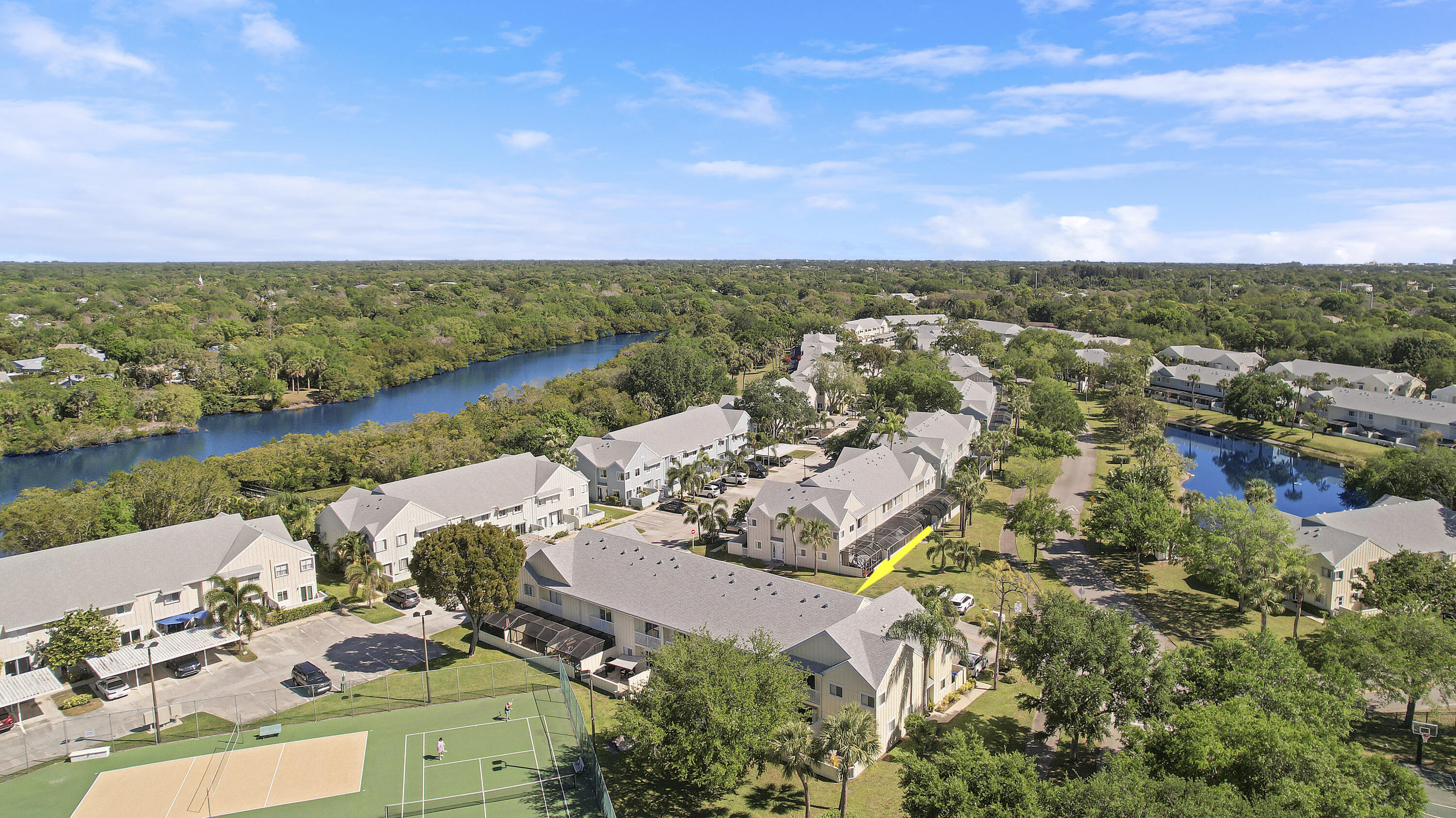 6263 Riverwalk Lane, Unit 2 Jupiter, FL 33458 - Photo 7 of 44 an aerial view of a house with a lake view
