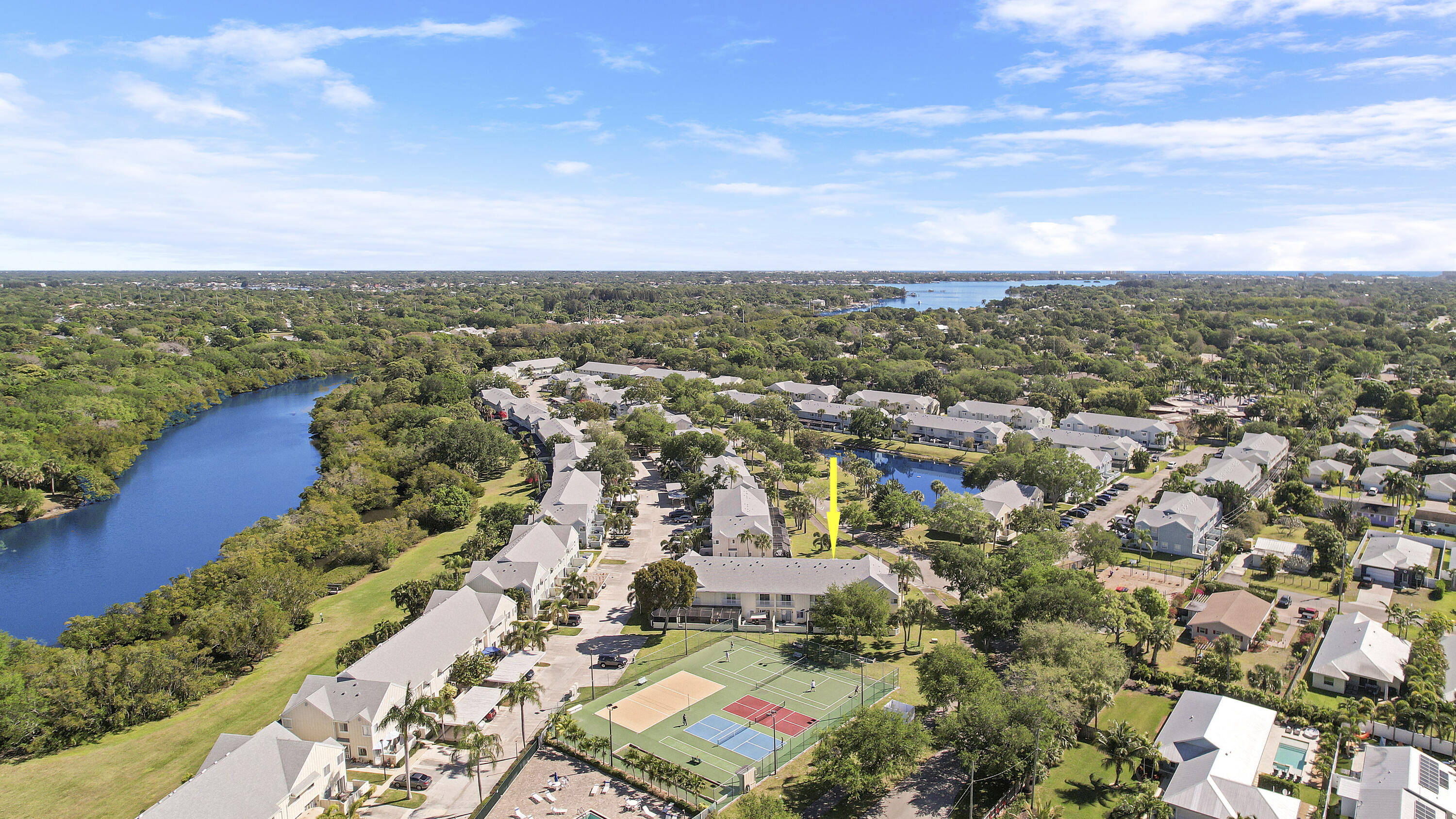 6263 Riverwalk Lane, Unit 2 Jupiter, FL 33458 - Photo 8 of 44 an aerial view of residential building with outdoor space