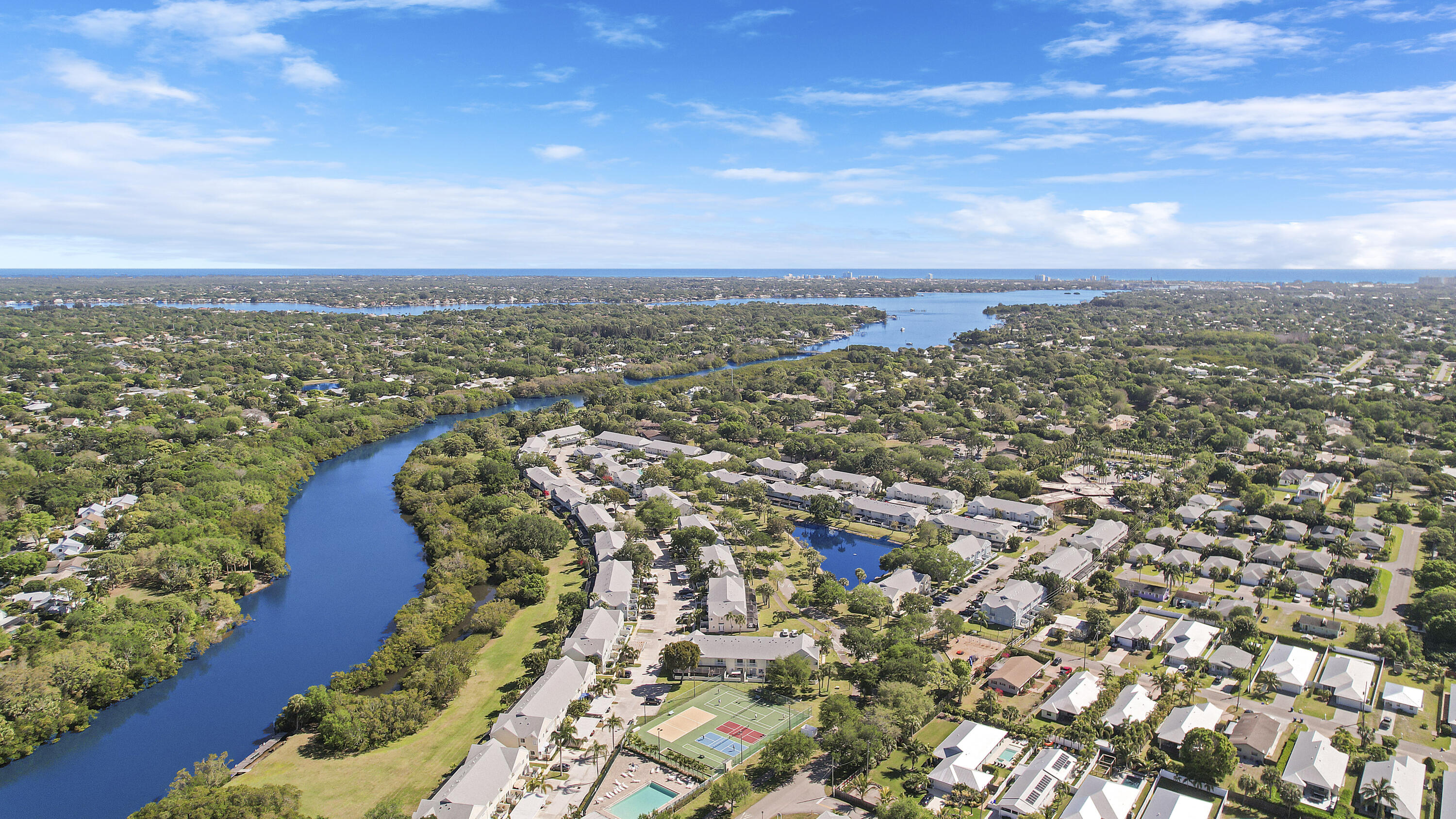 6263 Riverwalk Lane, Unit 2 Jupiter, FL 33458 - Photo 9 of 44 an aerial view of residential building with outdoor space