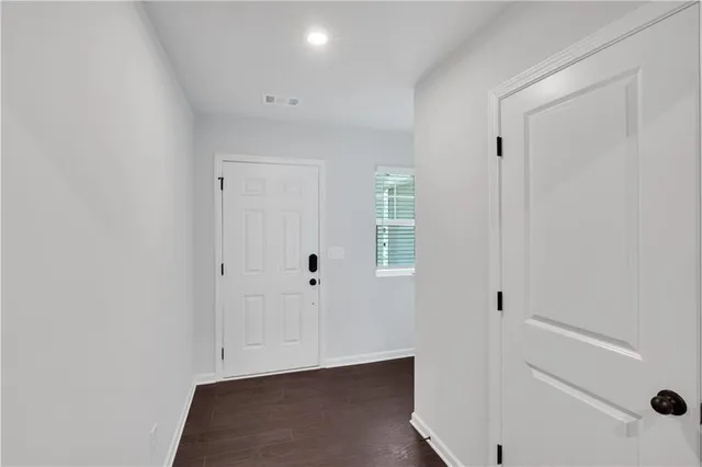 a kitchen with stainless steel appliances granite countertop a sink a refrigerator and a granite counter tops