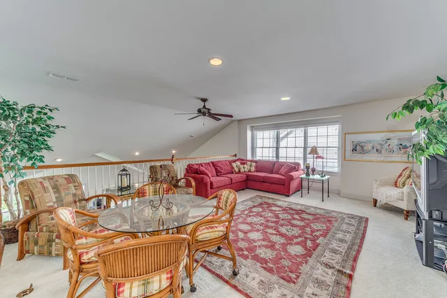 a living room with furniture and a rug