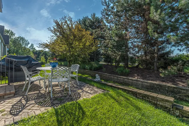 a view of outdoor dining space with a backyard