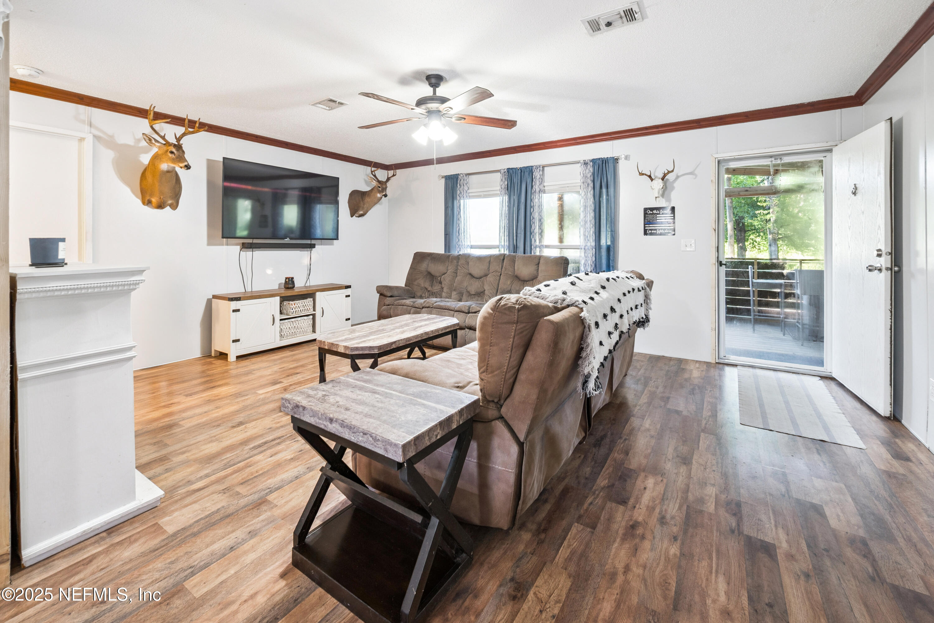 7236 Southeast 163rd Lane Lake Butler, FL 32054 - Photo 18 of 35 a view of a livingroom with furniture window and wooden floor