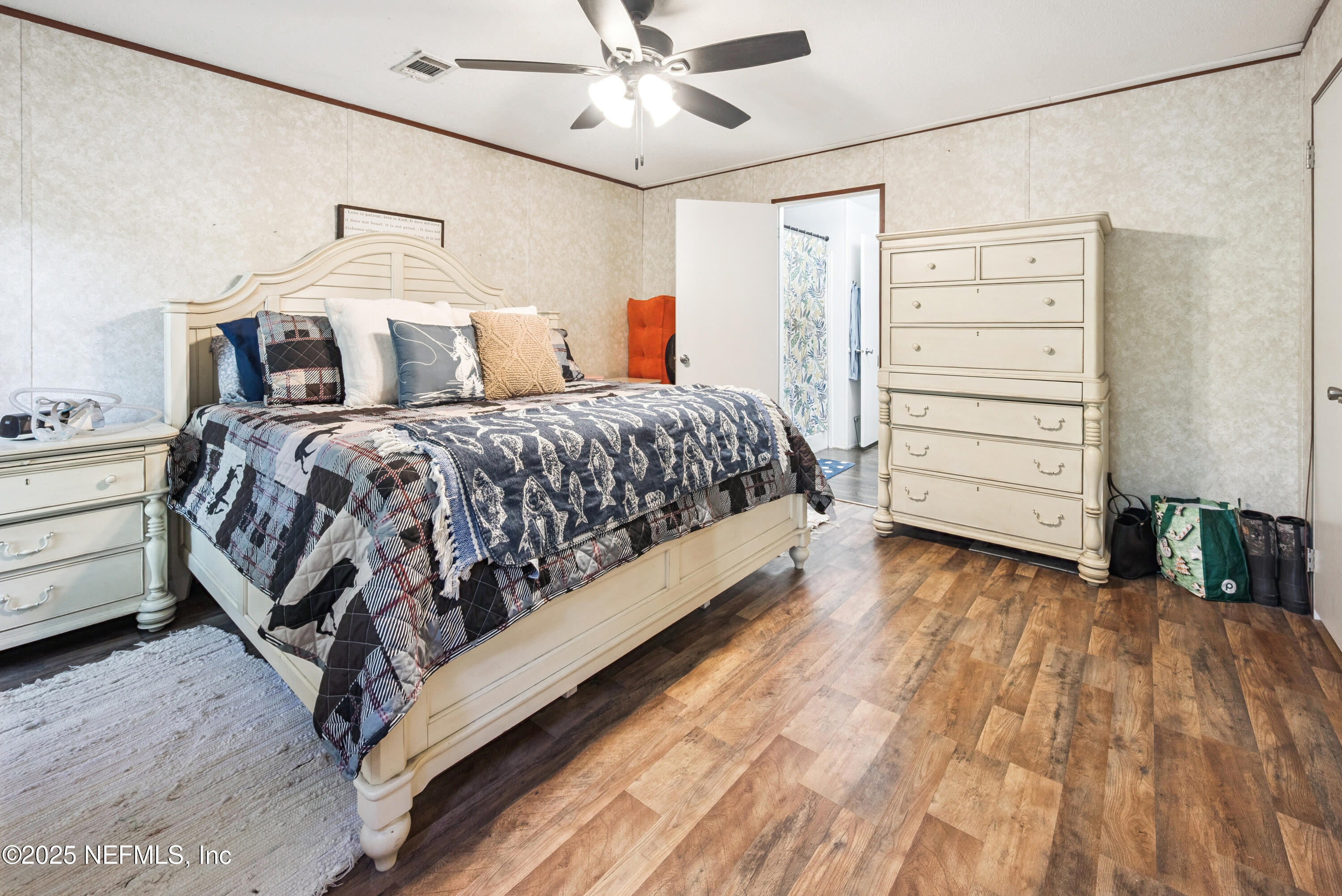 7236 Southeast 163rd Lane Lake Butler, FL 32054 - Photo 20 of 35 a bedroom with a bed and a cabinets