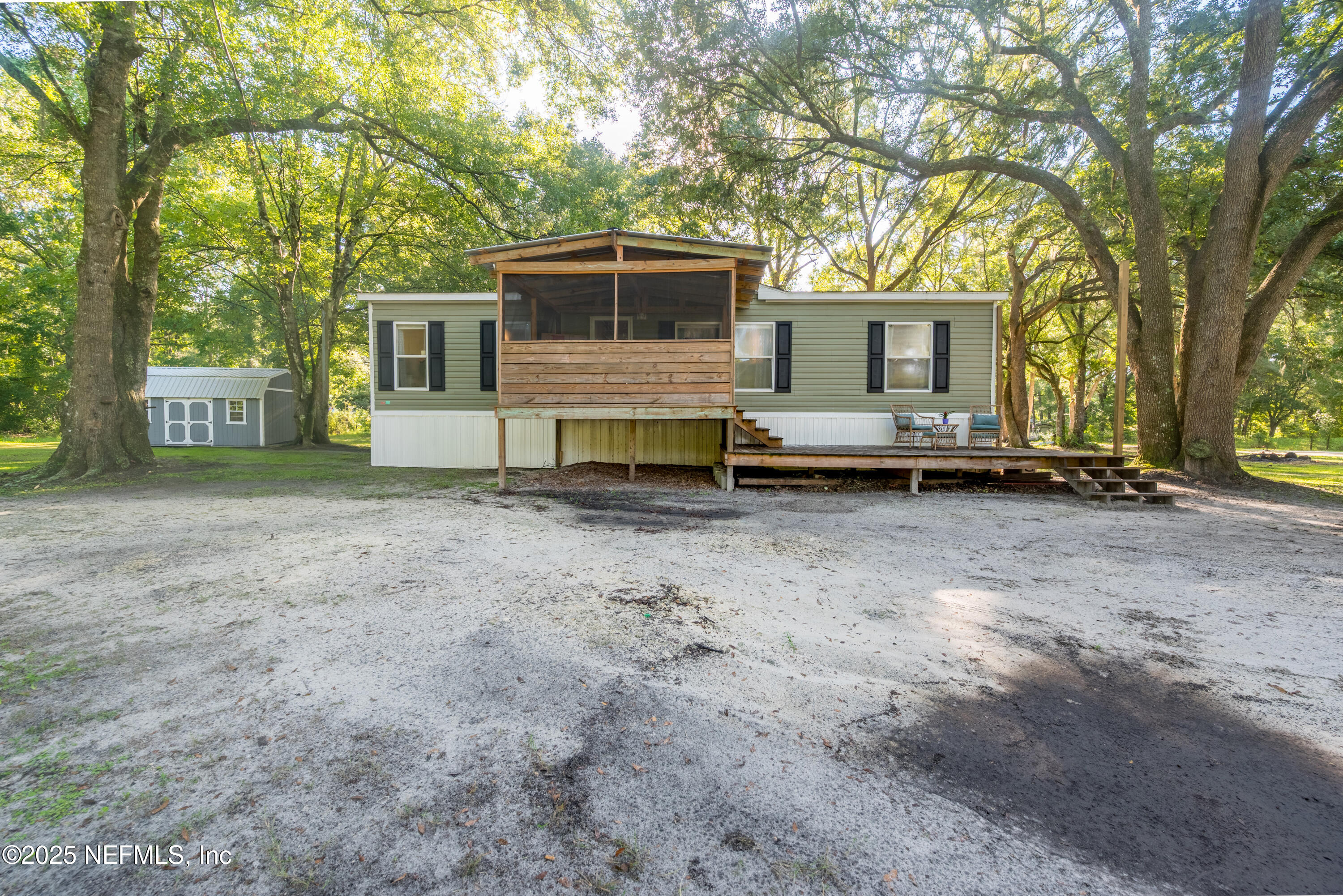 7236 Southeast 163rd Lane Lake Butler, FL 32054 - Photo 2 of 35 a front view of a house with a yard