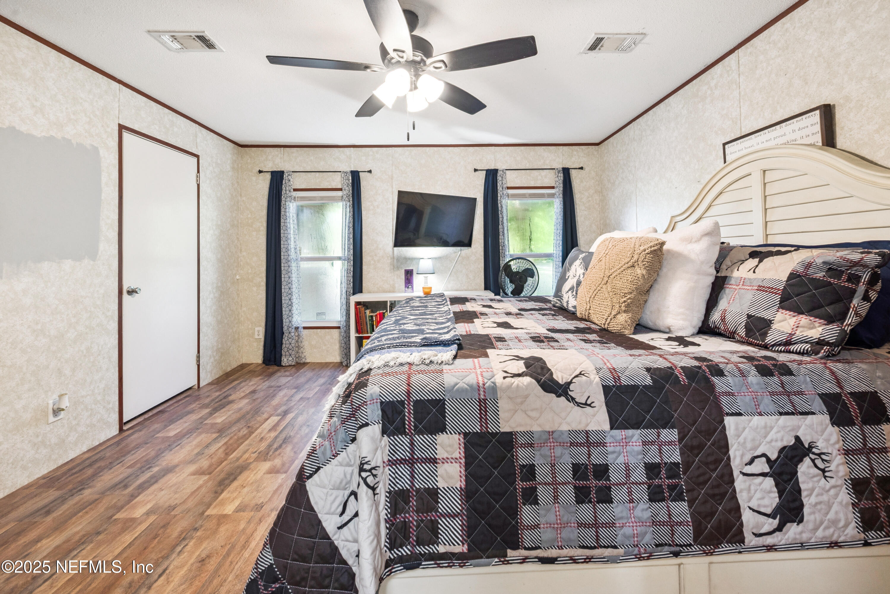 7236 Southeast 163rd Lane Lake Butler, FL 32054 - Photo 21 of 35 a bedroom with a bed mirror and window