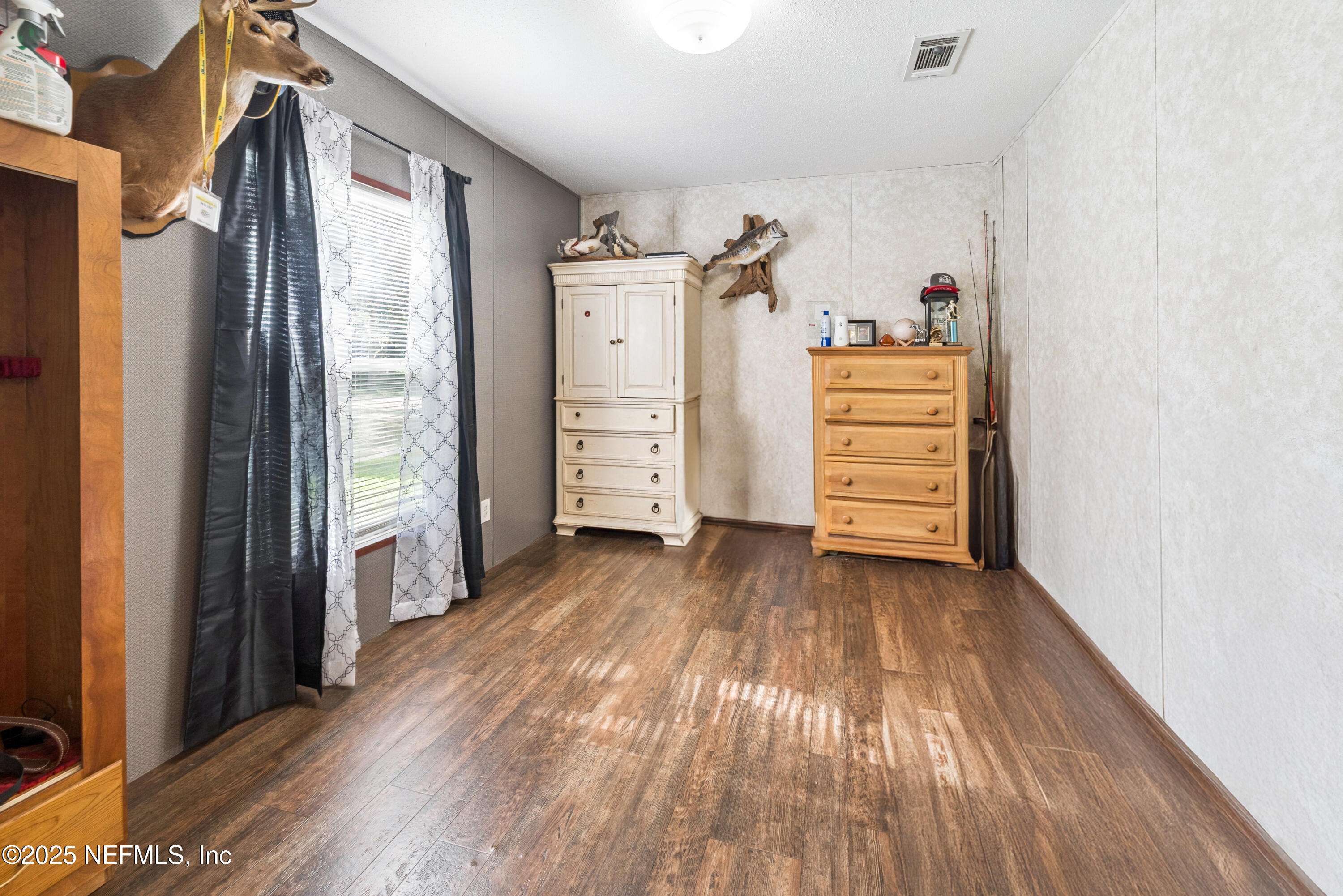 7236 Southeast 163rd Lane Lake Butler, FL 32054 - Photo 31 of 35 a view of walk in closet with clothes and shoes
