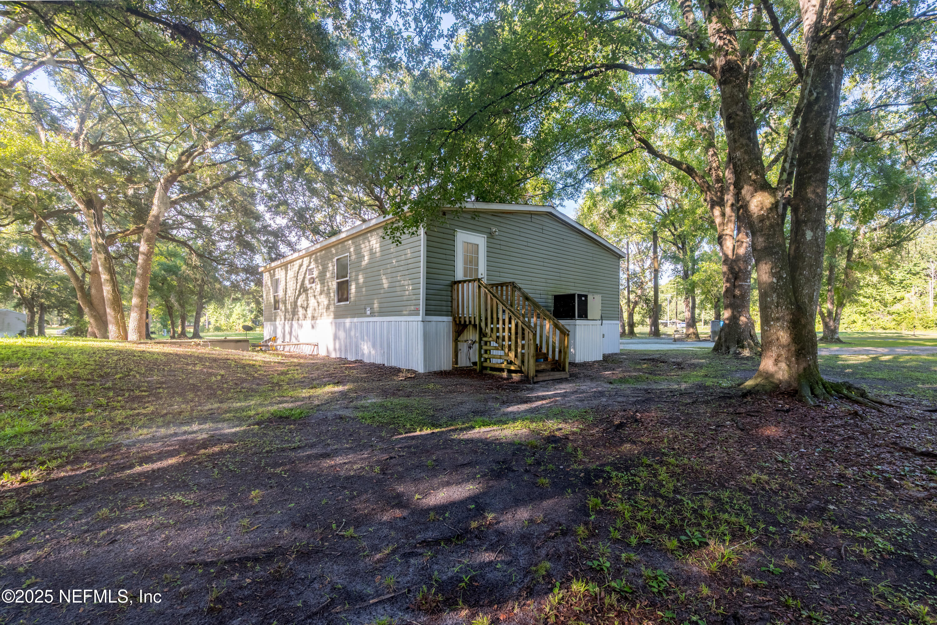 7236 Southeast 163rd Lane Lake Butler, FL 32054 - Photo 5 of 35 a view of a house with yard and tree s